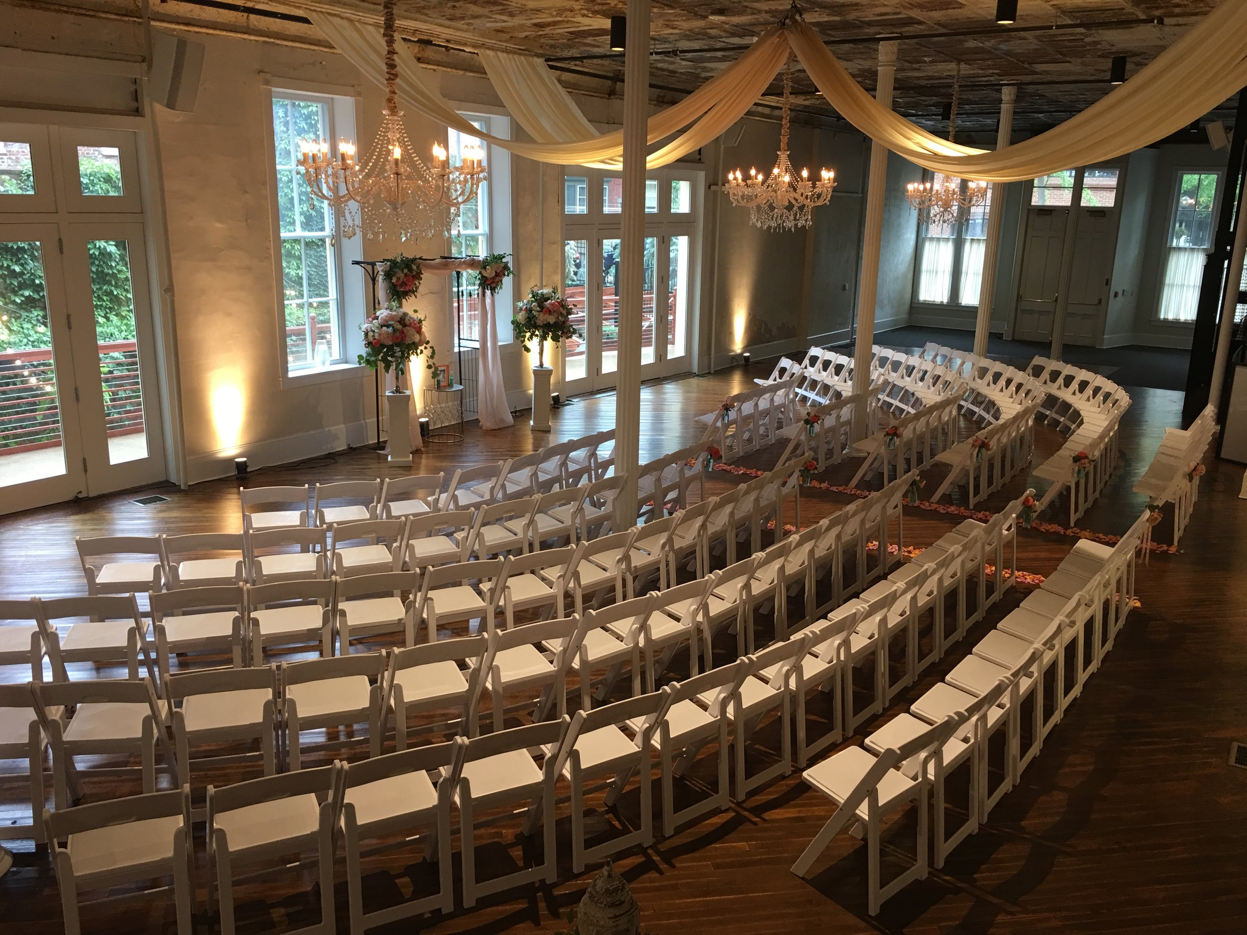 Grand Salon ceremony space set up white chairs uplighting