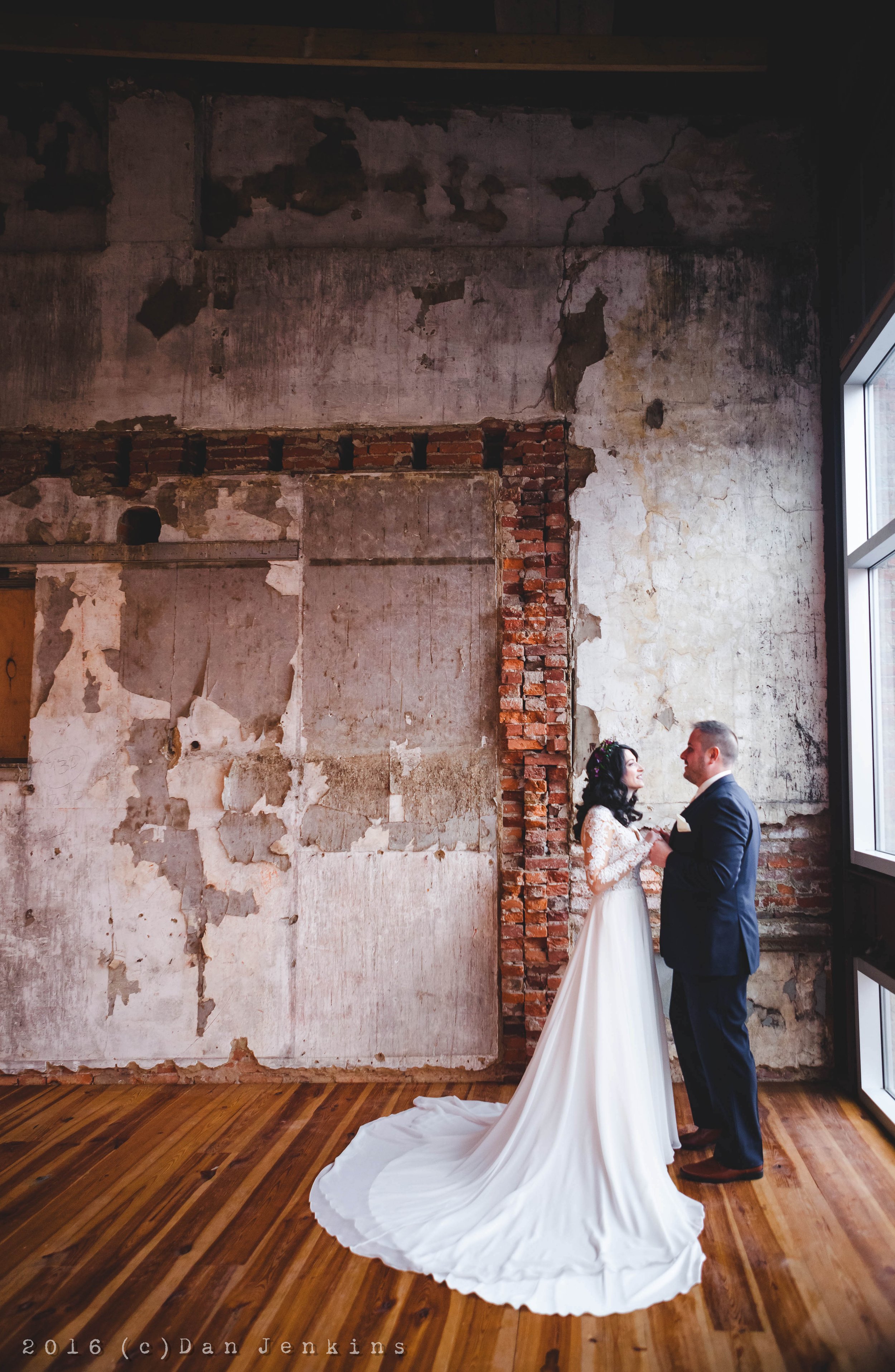 Bride and groom in eclectic antique room