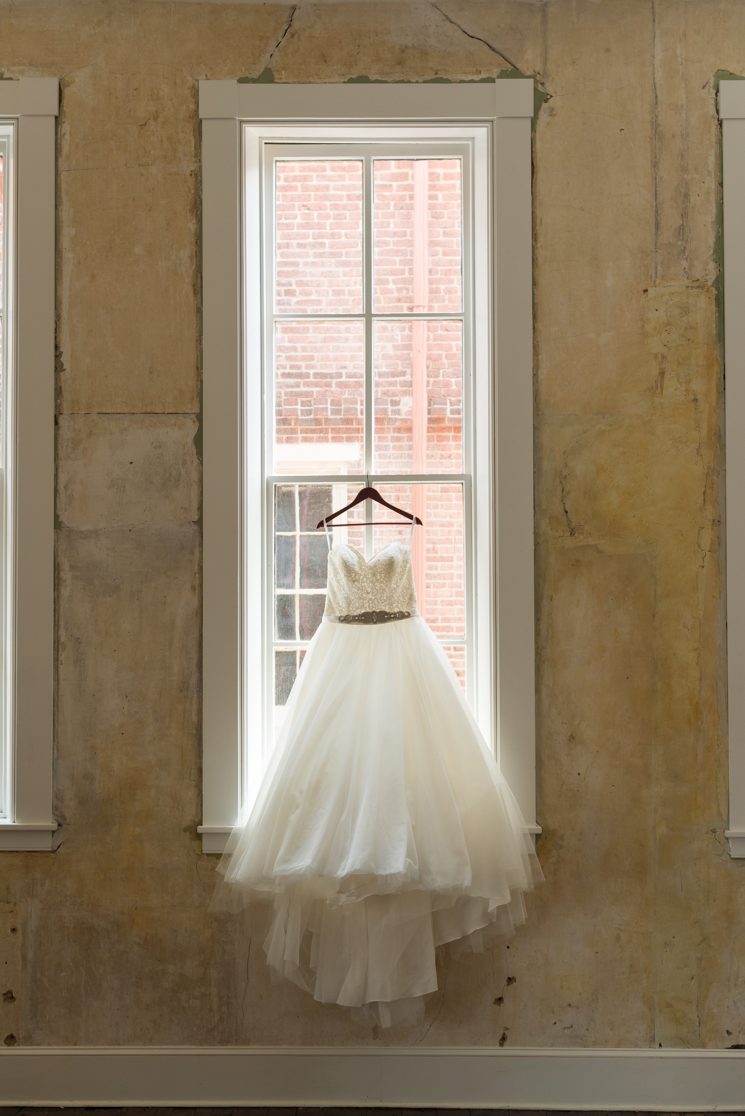 Wedding gown displayed in large tall window in Empire Room of Excelsior Lancaster PA