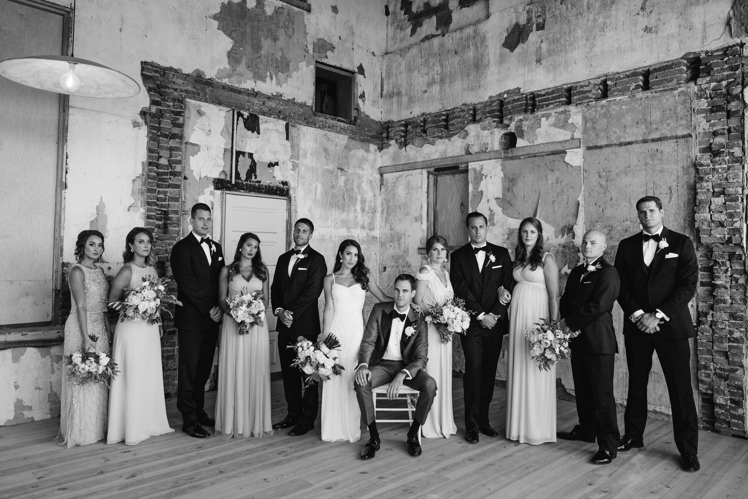 Bridal party in a rustic antique room black and white photo
