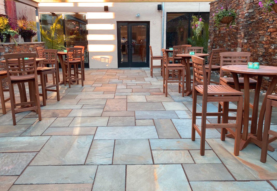 Outdoor patio beautiful stone floor wooden seating