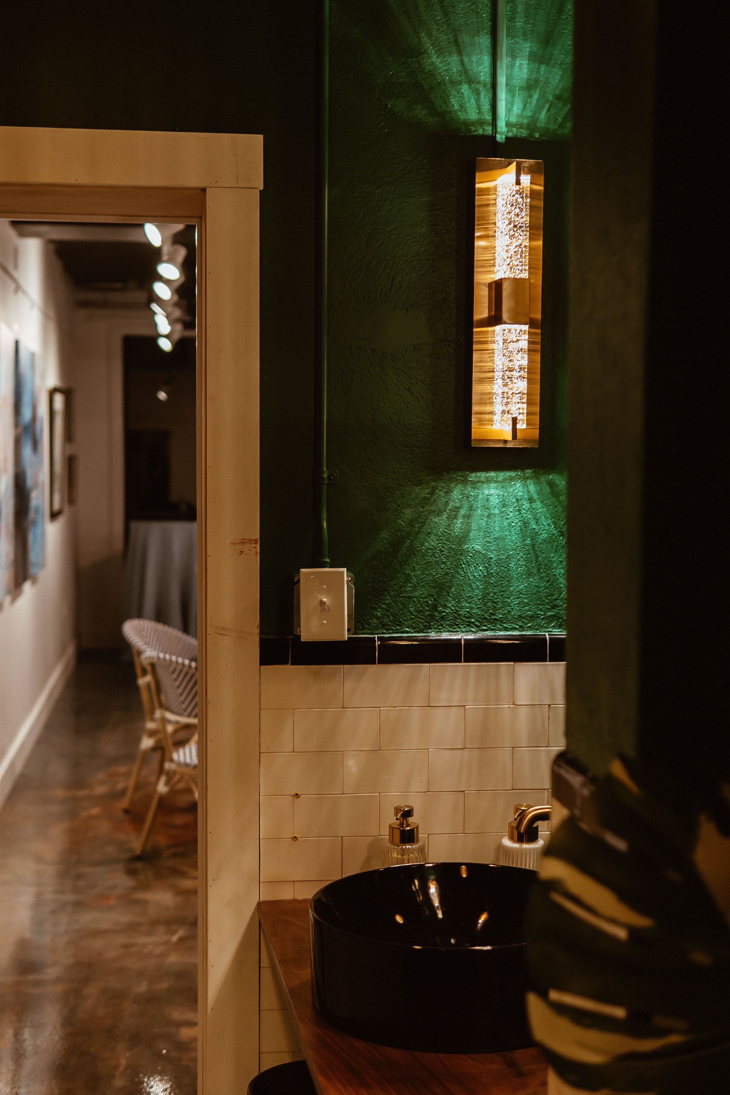 Green bathroom wall white tiles eclectic bubbled glass lamp