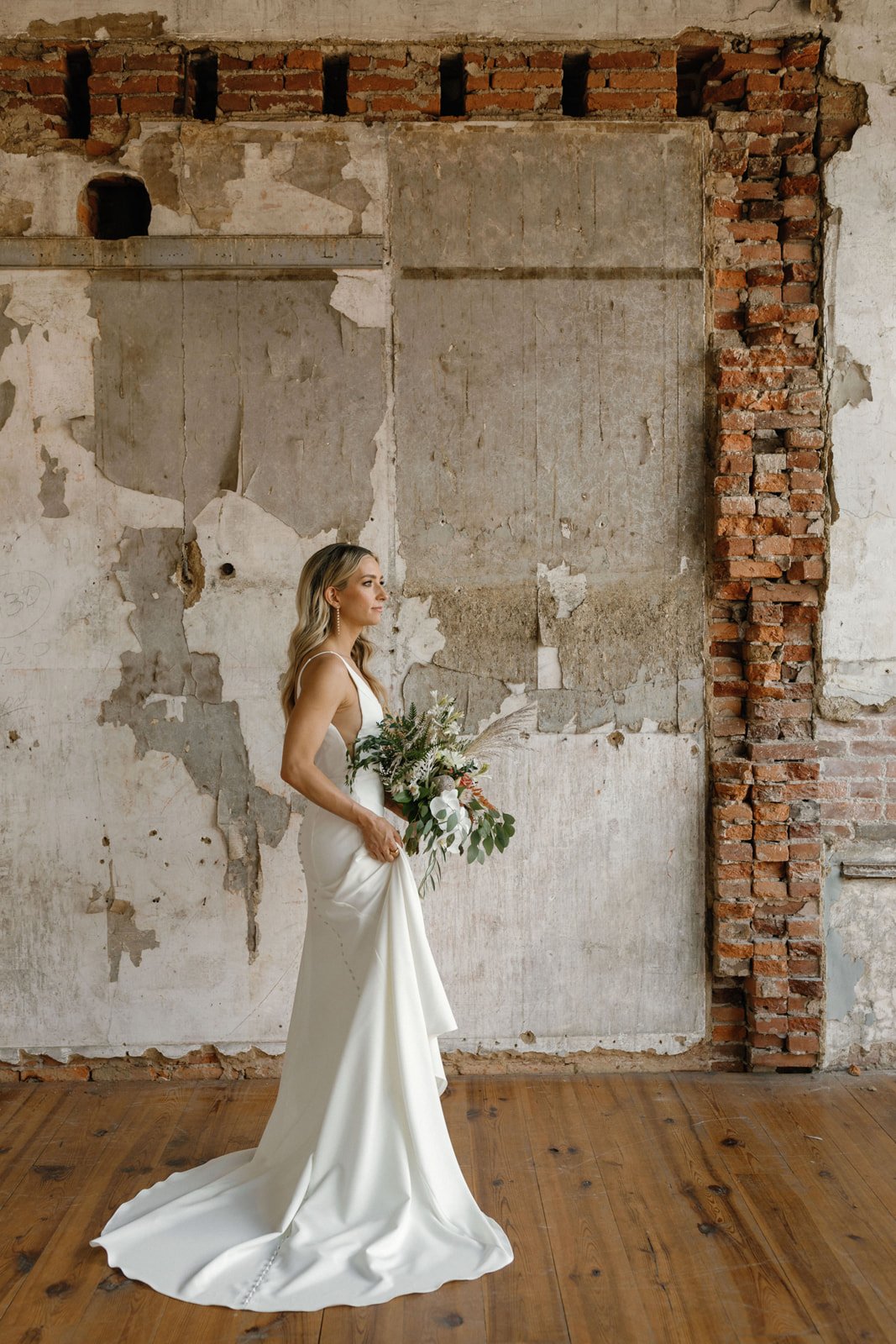 Bride posing in eclectic, unique and historic space