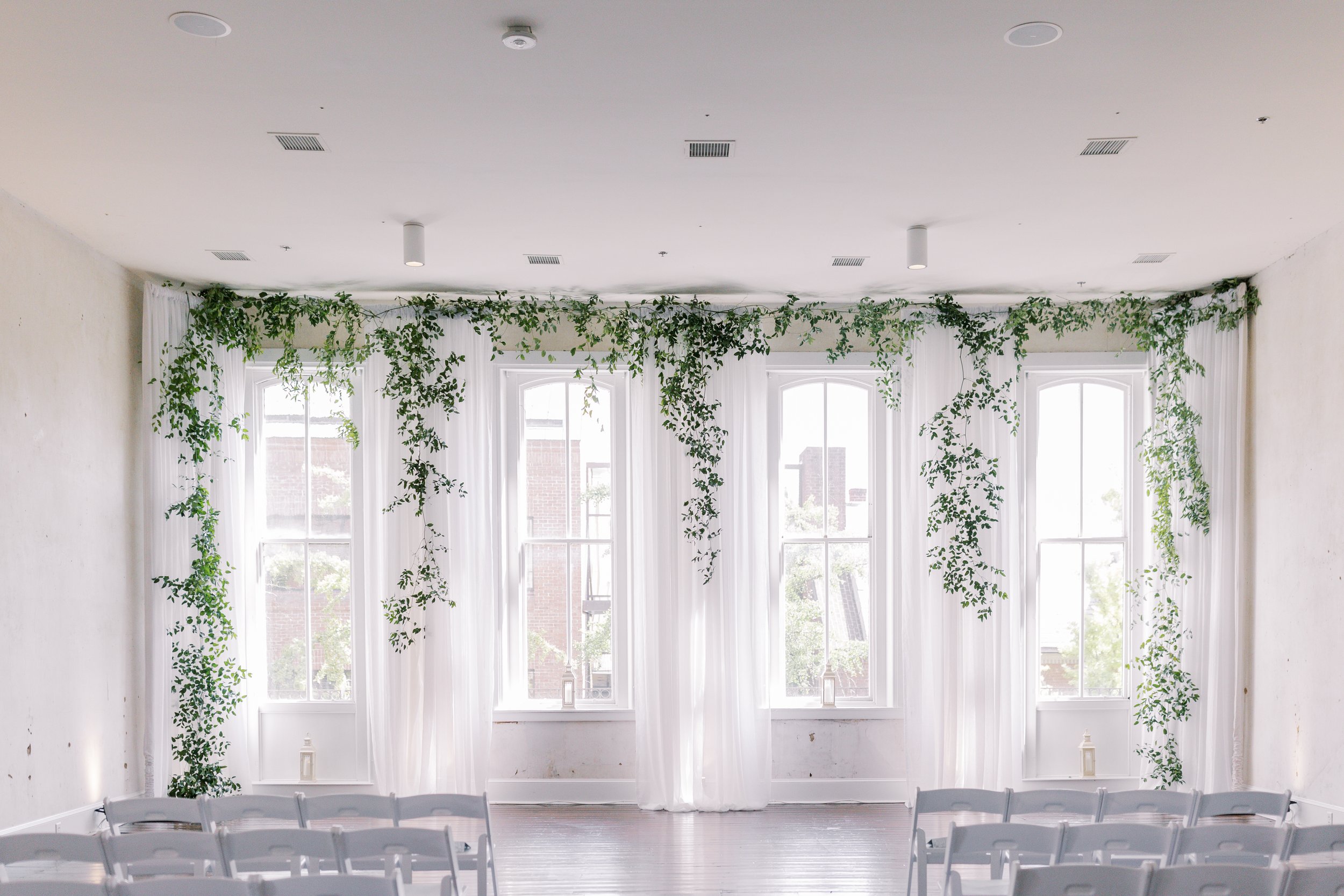 Greenery and white themed ceremony space
