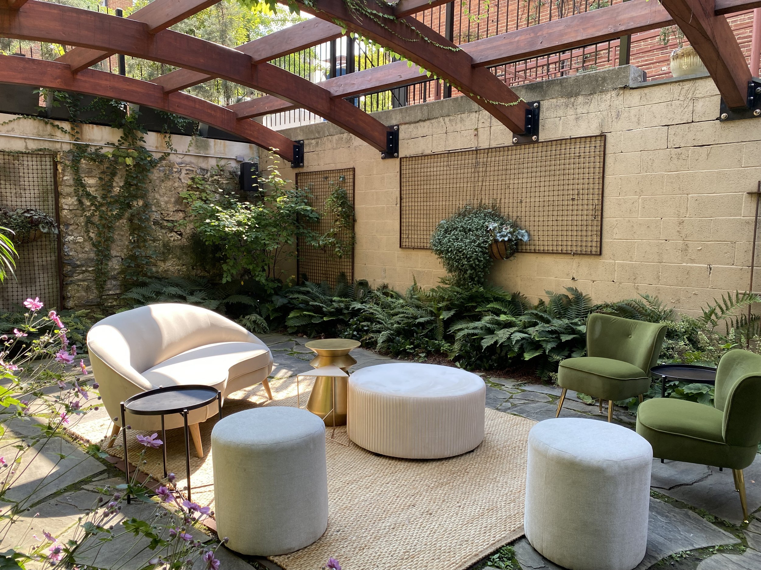 Lounge space seating contemporary set up outdoor pergola in Garden Courtyard of Excelsior Lancaster PA