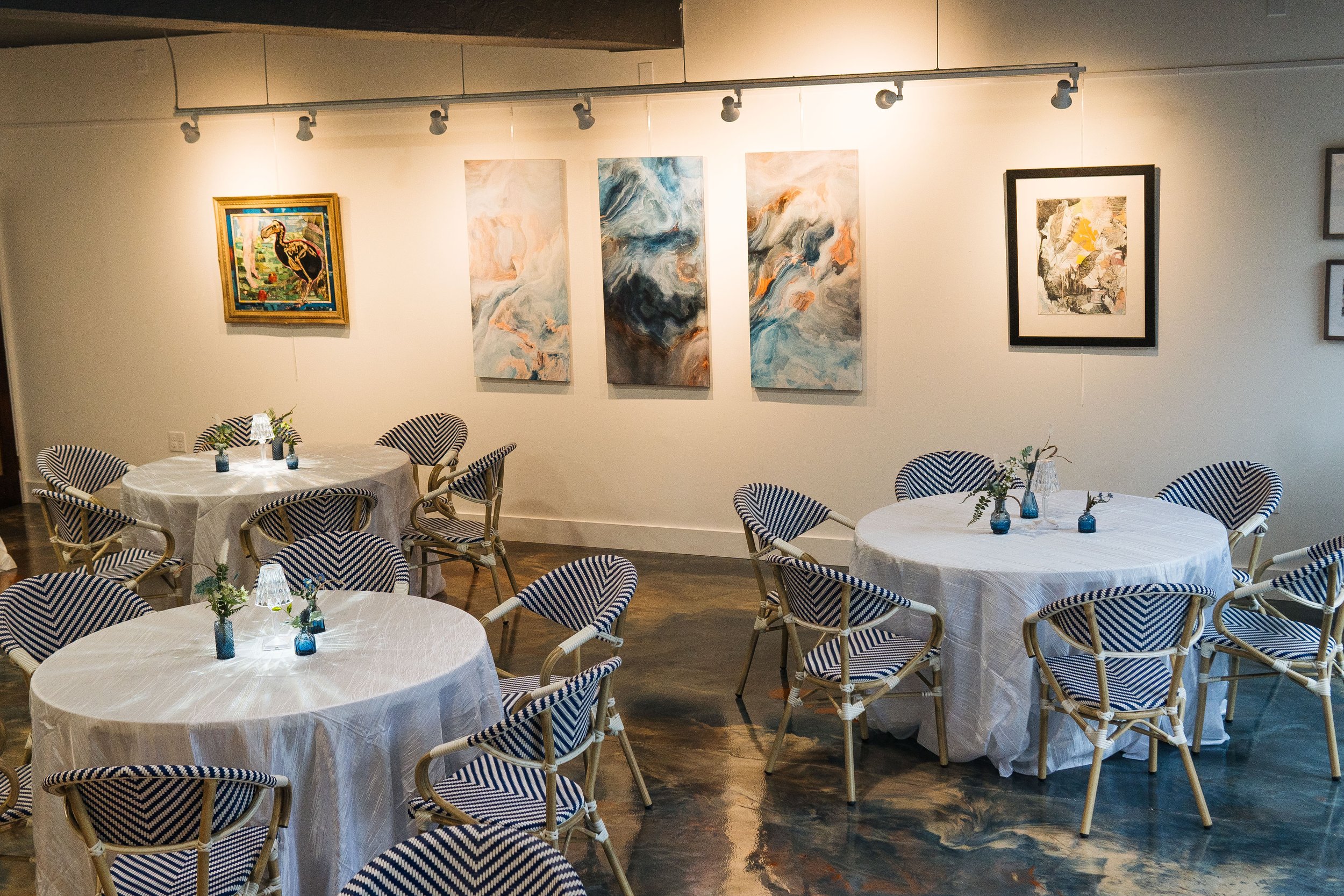 Showcased swirling artwork on walls with dining tables
