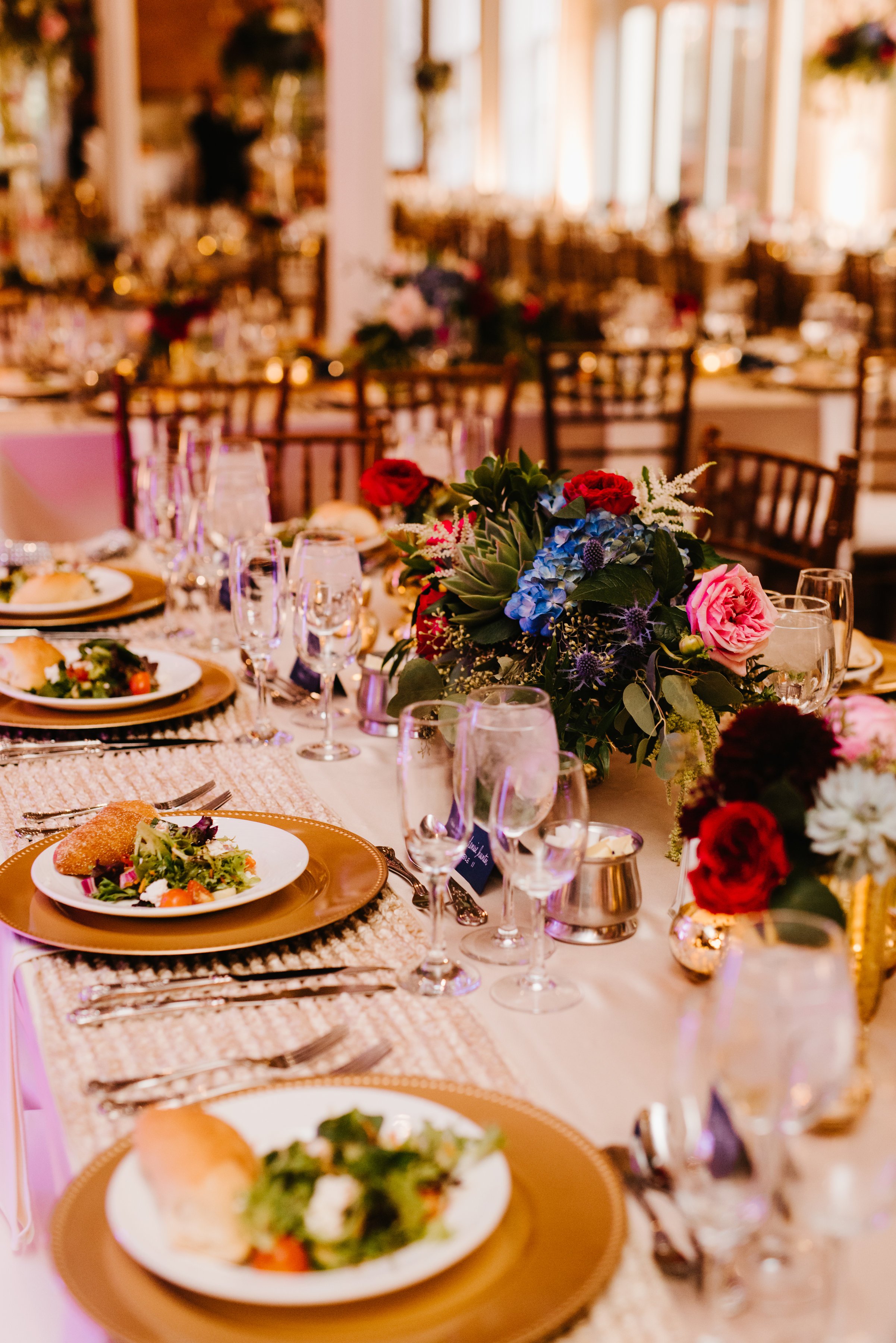 Tablescape at wedding reception bright and gold