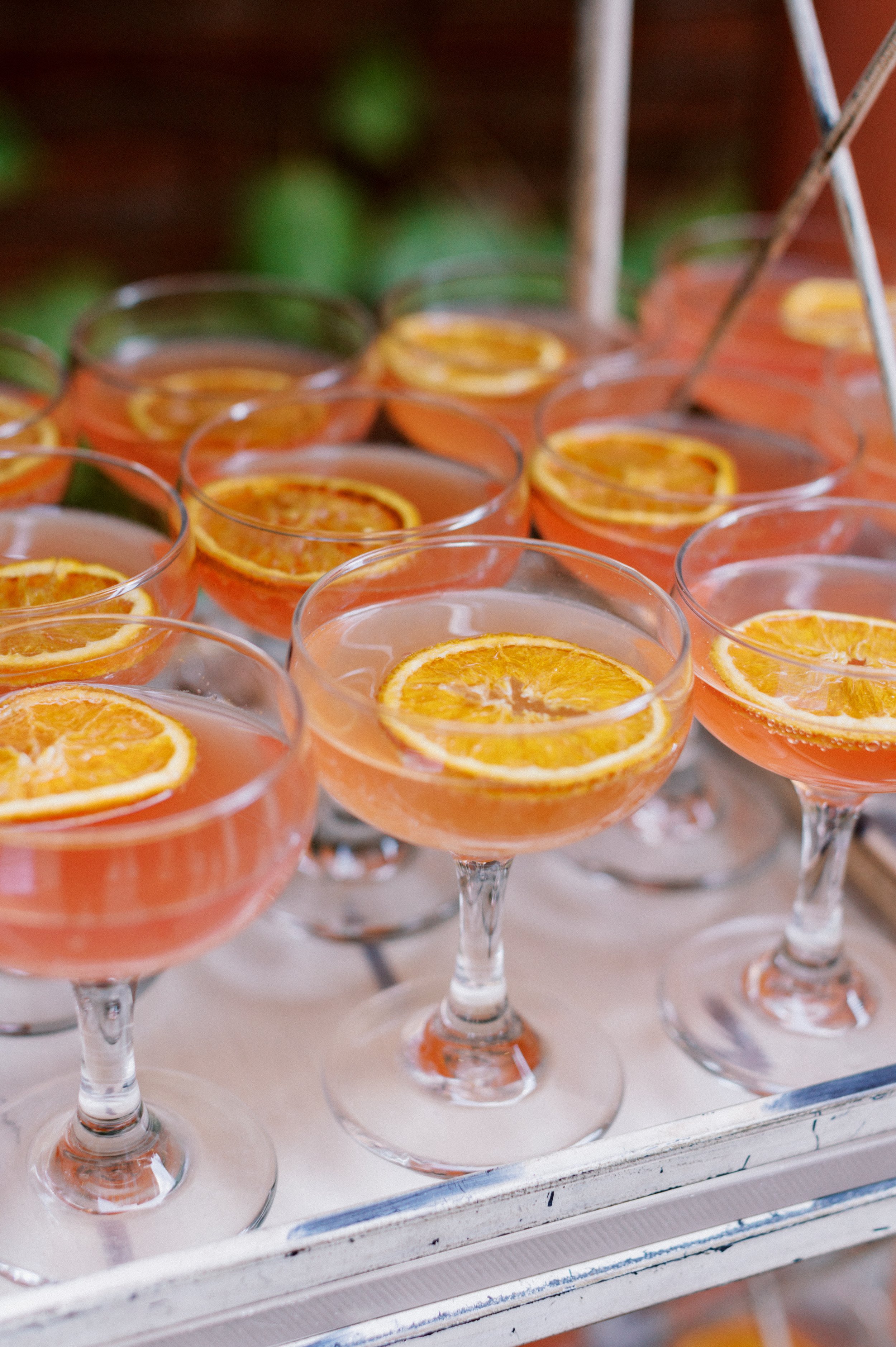 Pink cocktails with orange slice for social event at Excelsior 