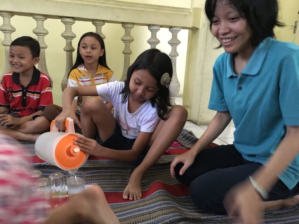 SAIN kids practicing hospitality to one another
