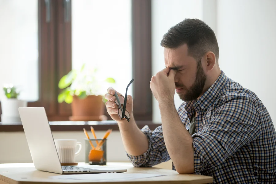 bigstock-Tired-Stressed-Male-Worker-Tak-241436326.jpg