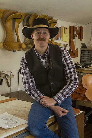 This portrait of Justin Thorson, saddle maker, is flat without flash. 