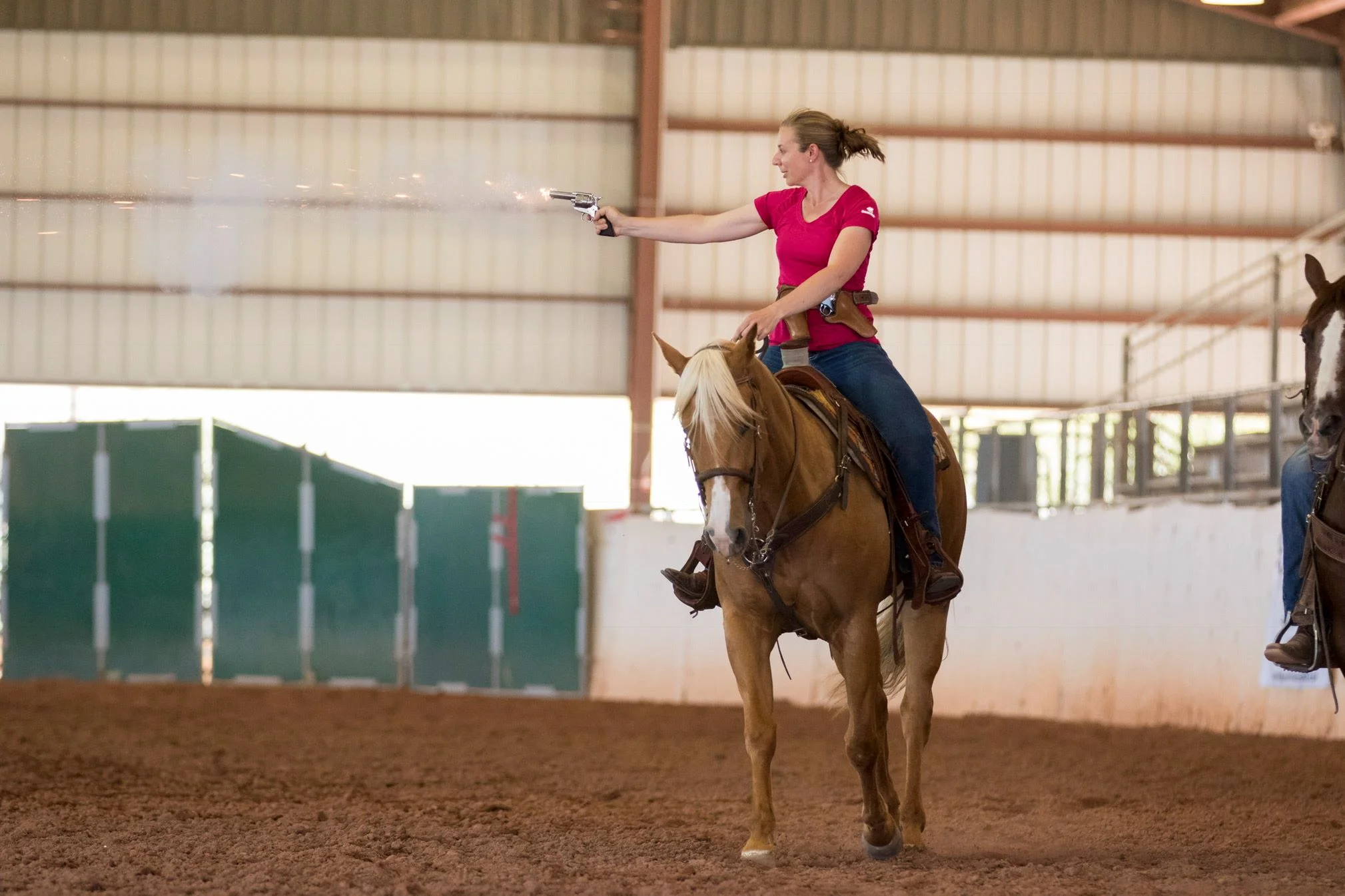 Katie Navarra participates in the mounted shooting demo at the 2017 AHP conference. (Photo by Vanessa Hughes / Lady Photographic)