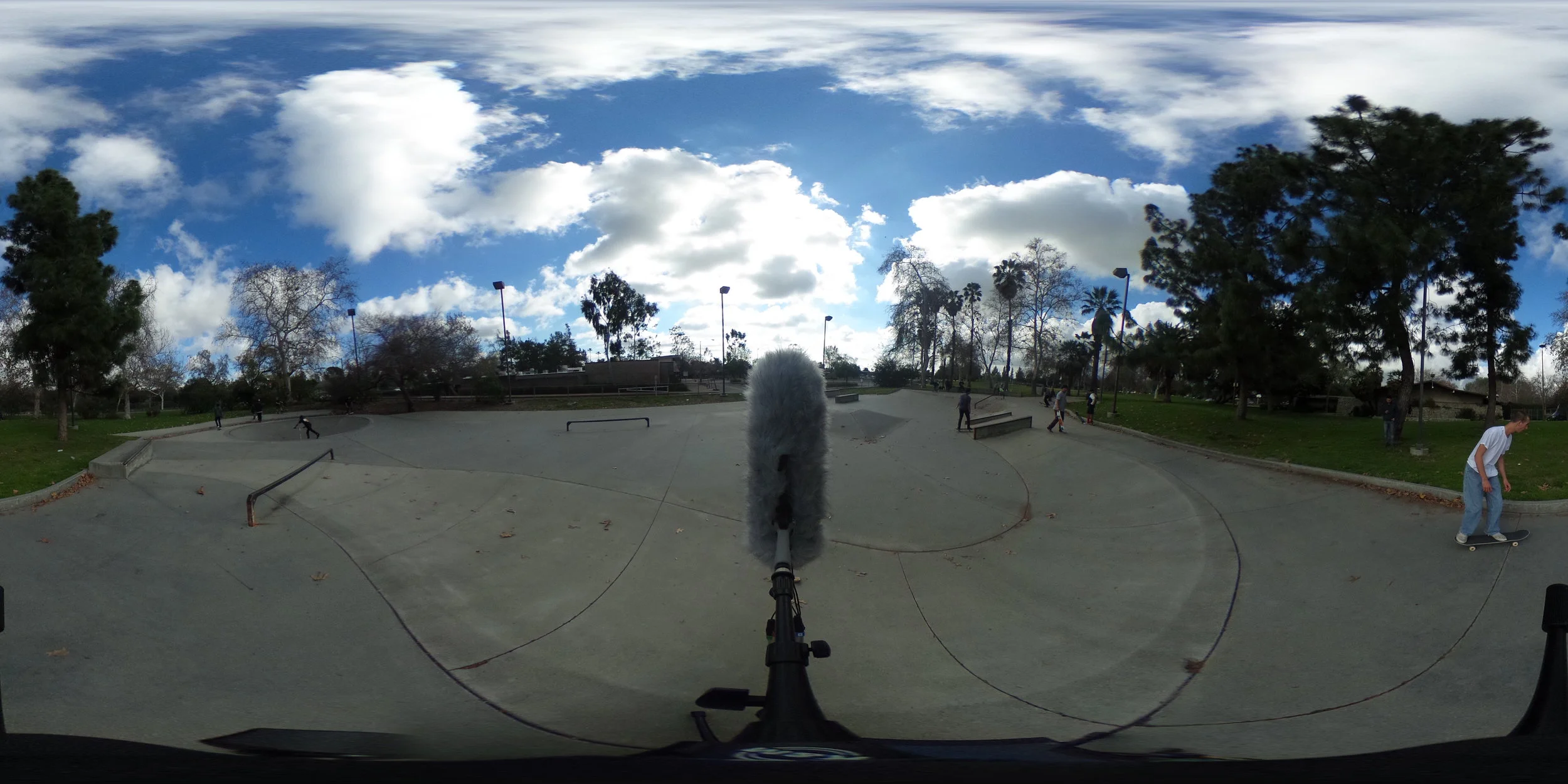 EXT_Day_Skatepark_SmallGroupsTalking_SkateboardBys_Stereo.JPG