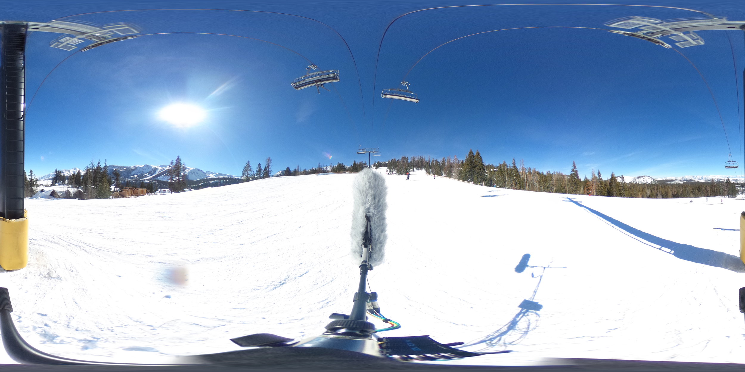 EXT_Day_SkiSlope_SkiLiftOverhead_SkiBys_SnowboardBys_VariousVoices_JPEG.JPG
