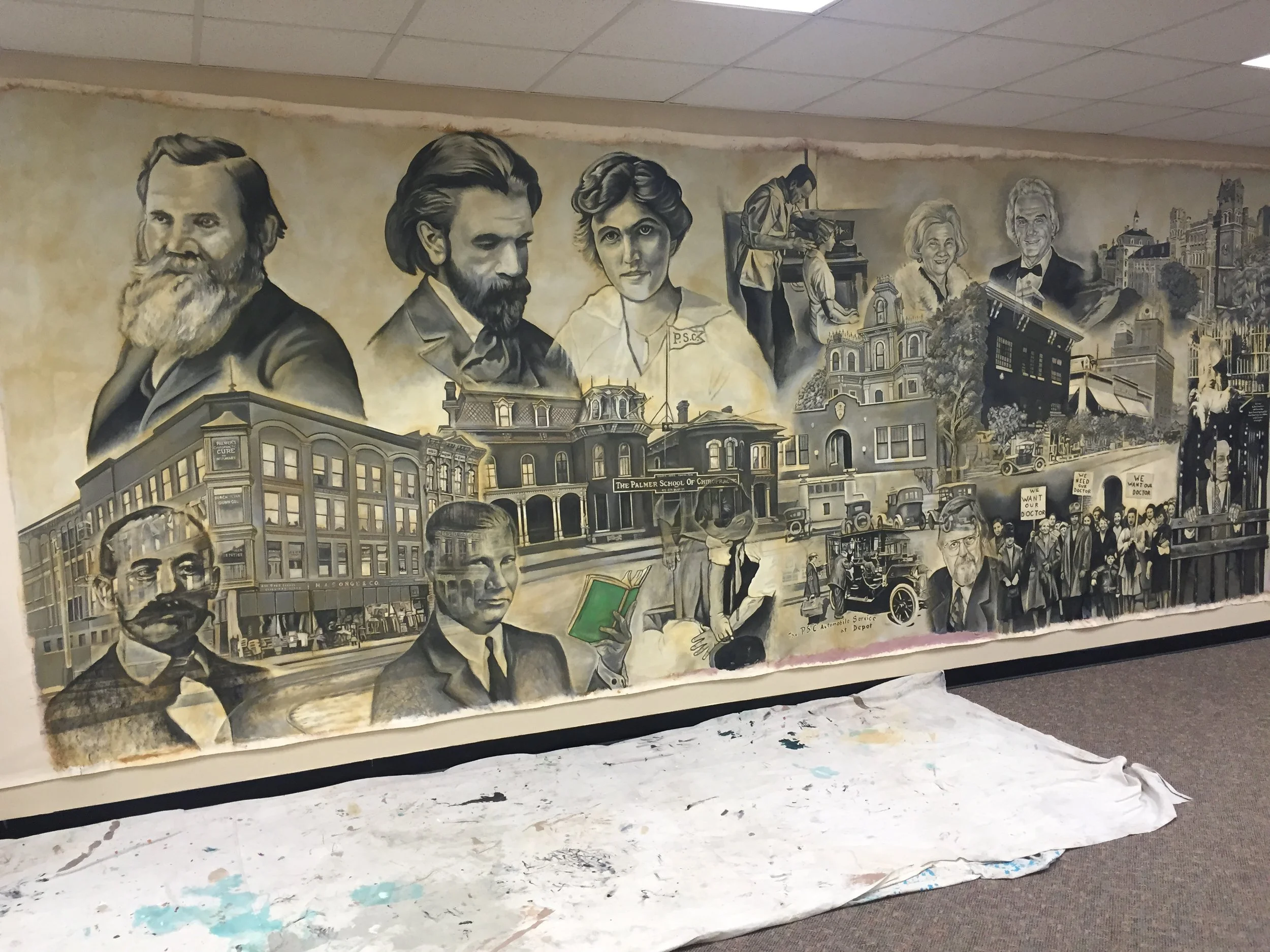 The mural being installed on location at Life Chiropractic West College.