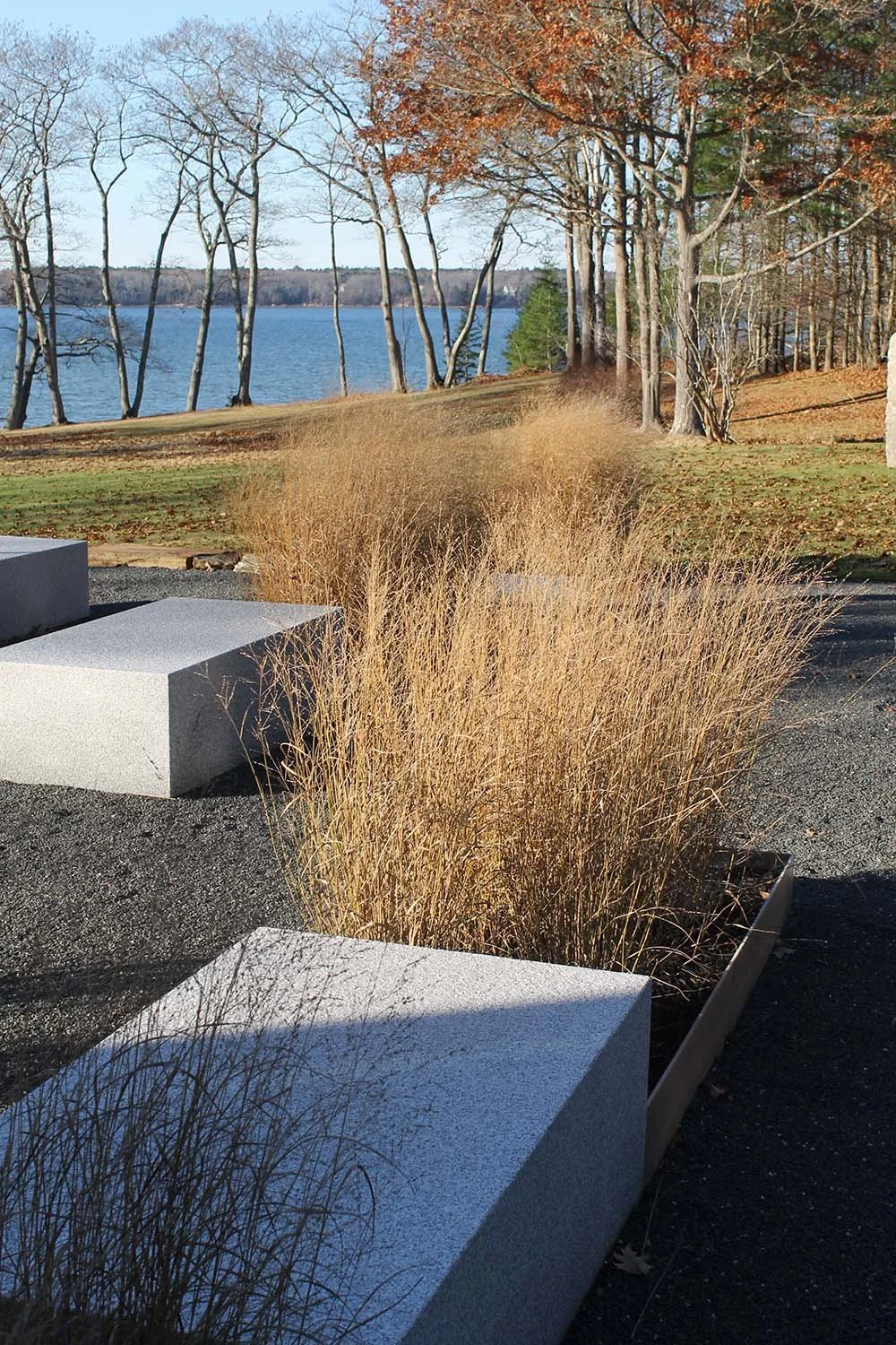  Whimsy grasses play counterpoint to the structure and heft of granite blocks.  