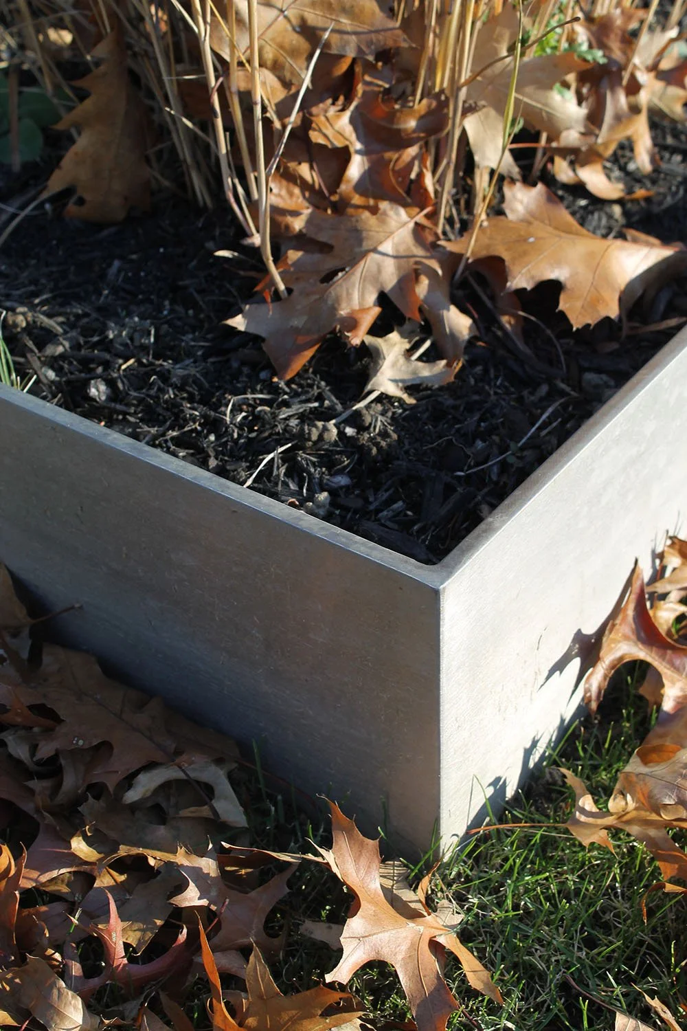  The crisp corners and luster of stainless steel planters. 