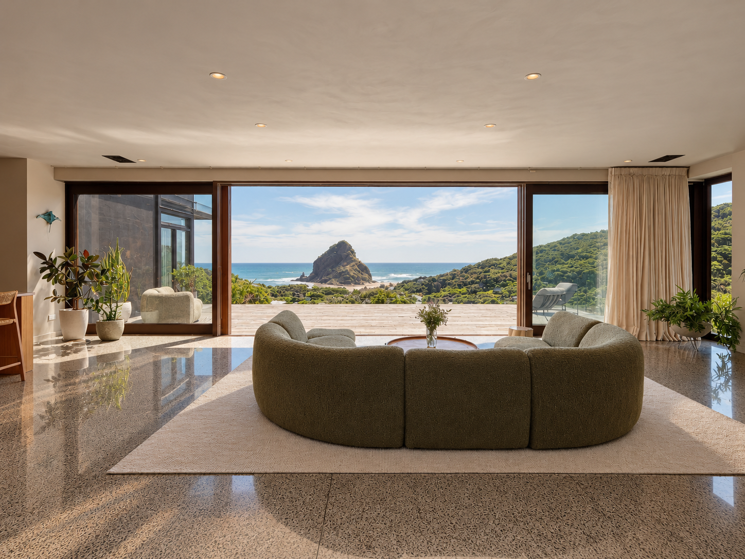 High Above New Zealand’s Black-Sand Piha Beach: A Four-Storey Home Overlooking Lion Rock and the Tasman Sea