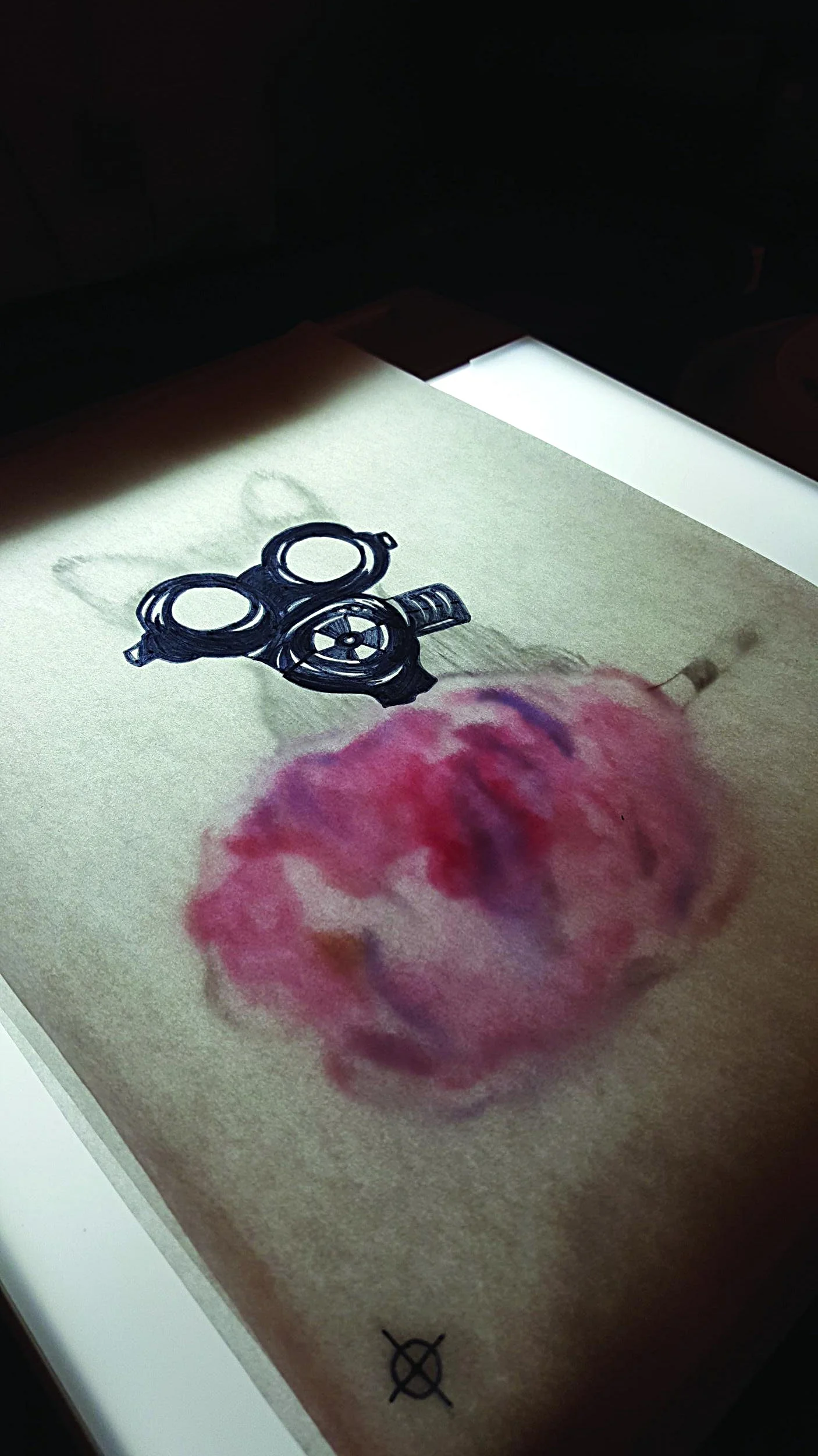  Three layers designed for exposure to create this screen print aligned on a light box. 