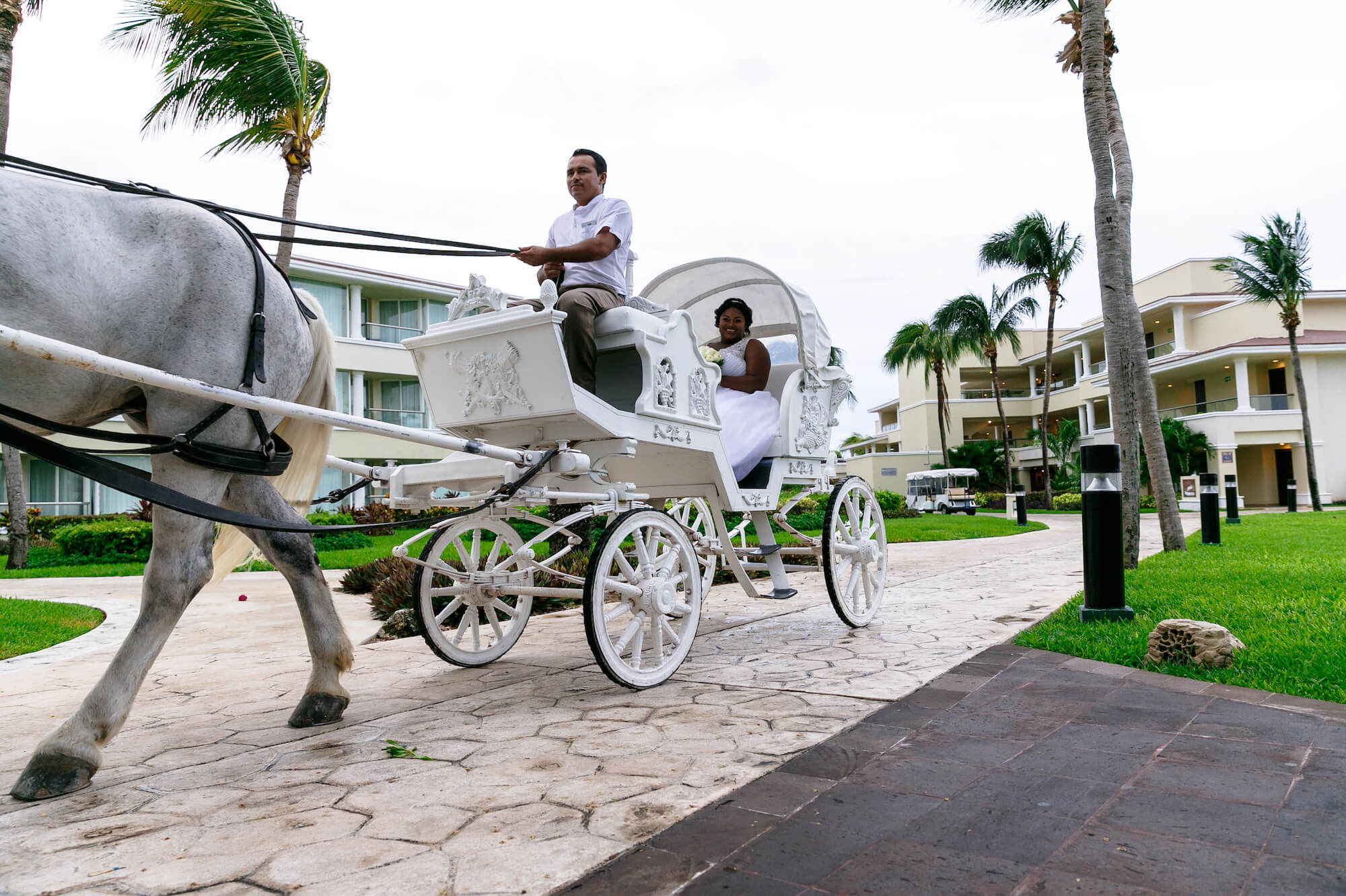 tressa-how-to-plan-a-destination-wedding-in-cancun-mexico-moon-palace-resort-black-destination-bride-destiland-desti-guide-to-destination-weddings-horse-carriage.jpg