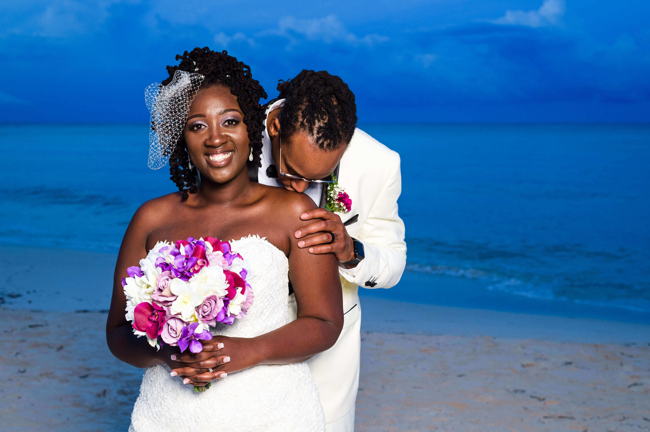 jamellah-how-to-plan-a-destination-wedding-in-montego-bay-jamaica-royalton-blue-waters-black-destination-bride-destiland-desti-guide-to-destination-weddings-couple-beach-after-ceremony.jpg
