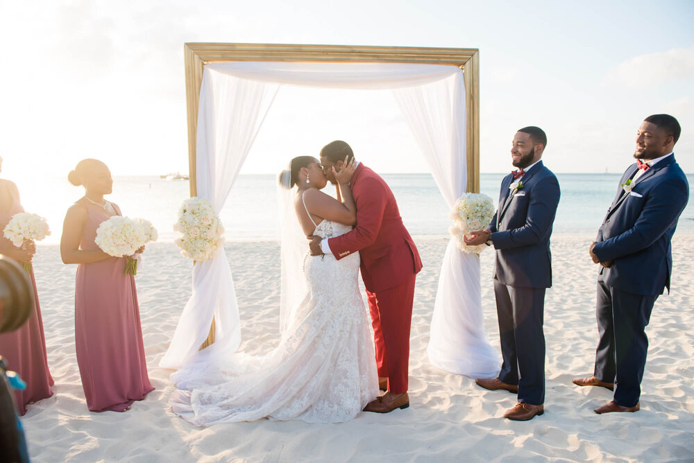 laura-how-to-plan-a-destination-wedding-in-oranjestad-aruba-hilton-aruba-resort-black-destination-bride-desti-tv-desti-guide-to-destination-weddings-2020-kiss.jpg