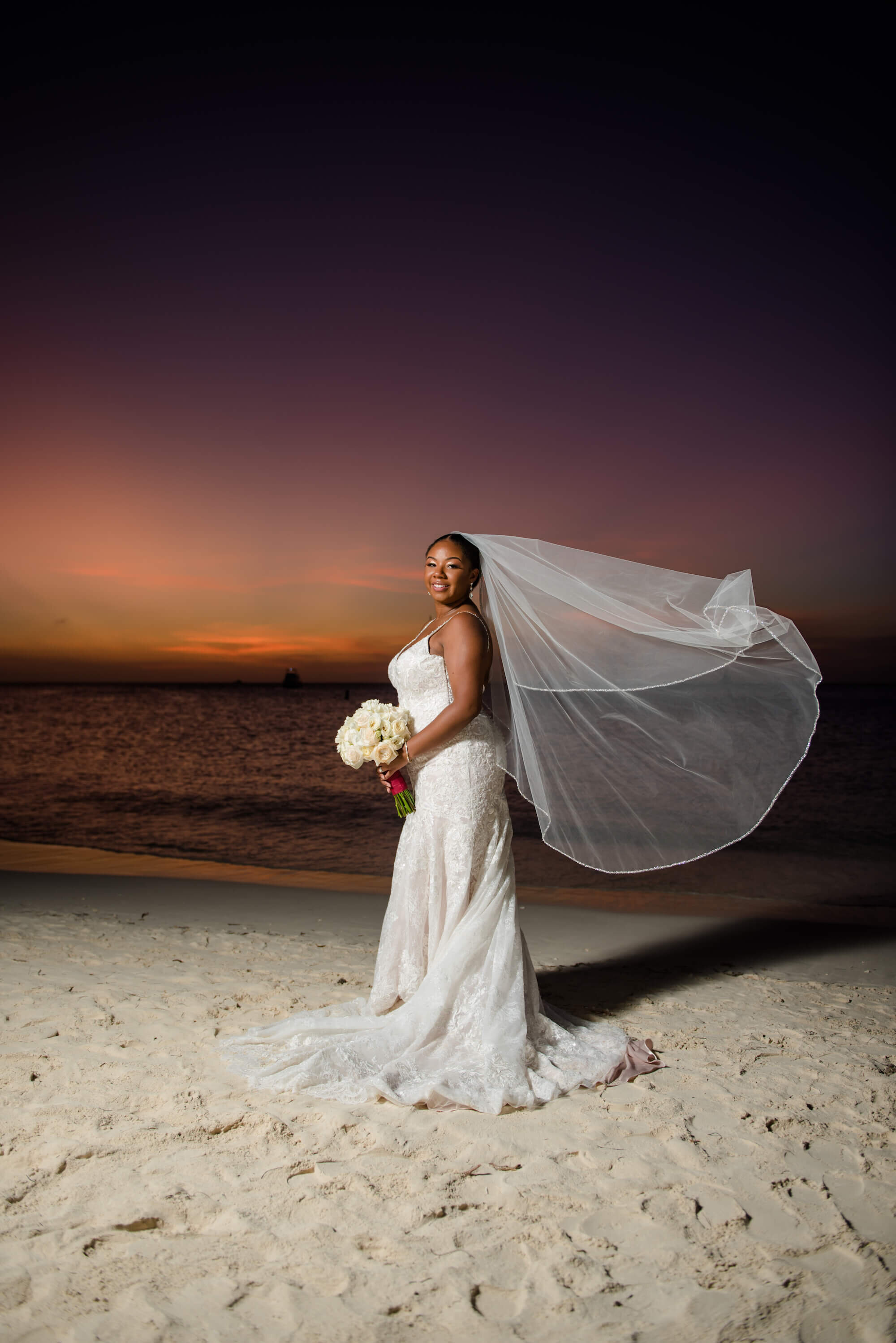 laura-how-to-plan-a-destination-wedding-in-oranjestad-aruba-hilton-aruba-resort-black-destination-bride-desti-tv-desti-guide-to-destination-weddings-2020-bride-beach-veil.jpg