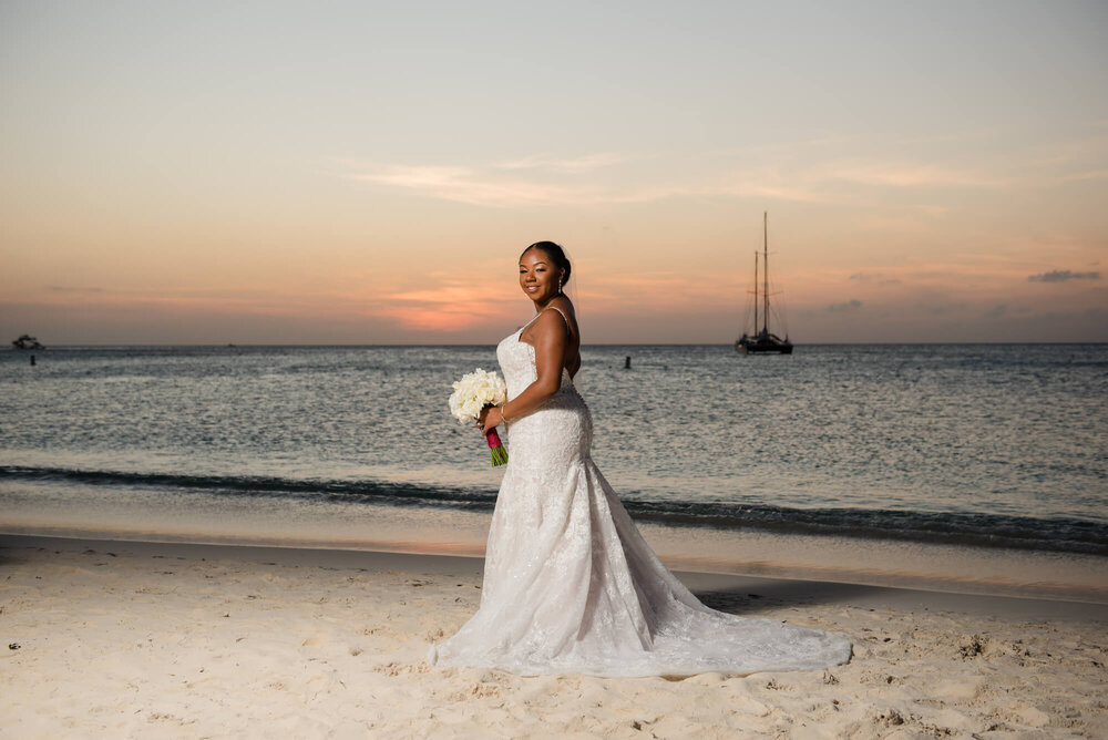 laura-how-to-plan-a-destination-wedding-in-oranjestad-aruba-hilton-aruba-resort-black-destination-bride-desti-tv-desti-guide-to-destination-weddings-2020-bride-beach.jpg