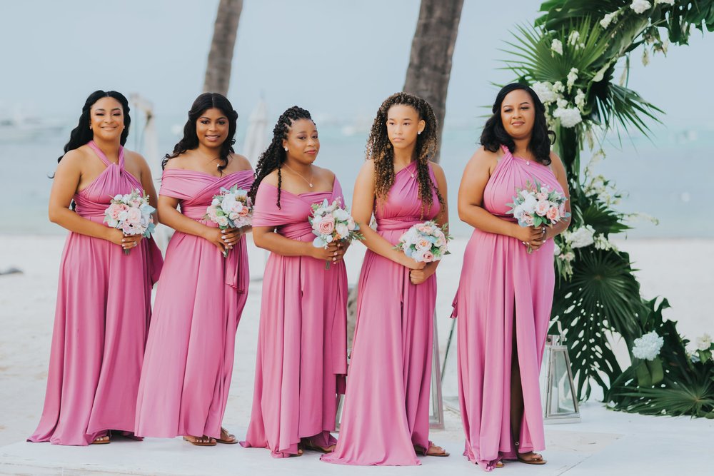 destibride-nicole-how-to-plan-a-destination-wedding-in-punta-cana-dominican-republic-jellyfish-restaurant-black-destination-bride-desti-tv-desti-guide-to-destination-weddings-2021-bridesmaids-pink-gown-beach.jpg