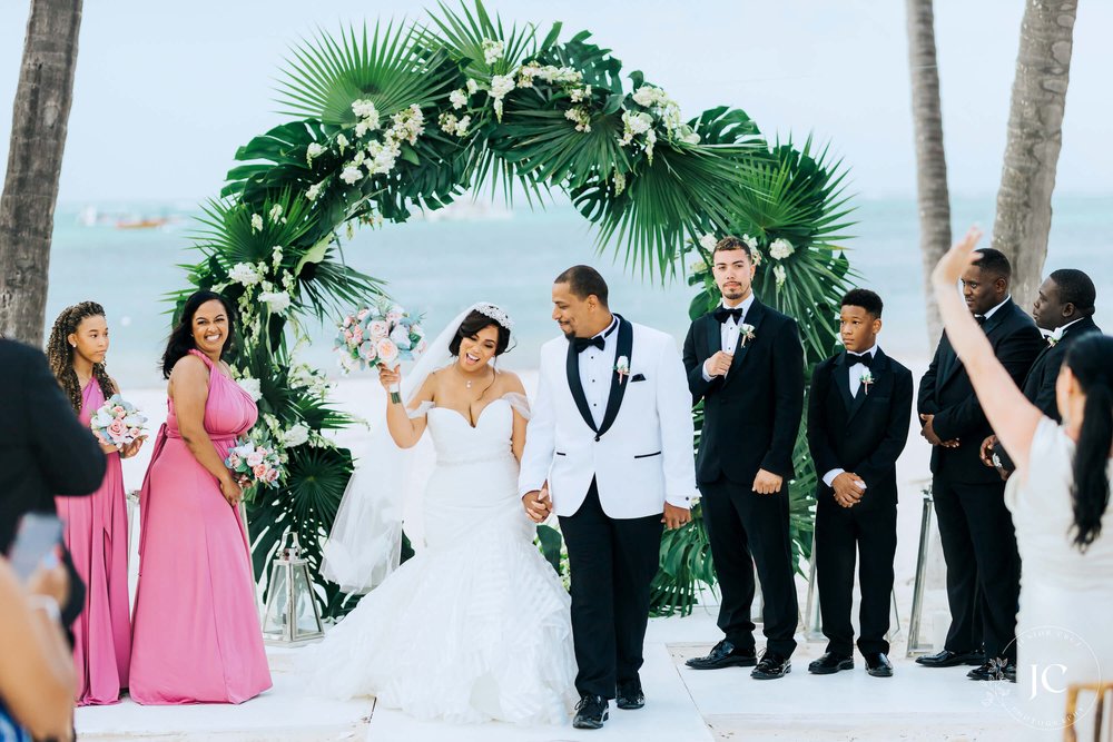 destibride-nicole-how-to-plan-a-destination-wedding-in-punta-cana-dominican-republic-jellyfish-restaurant-black-destination-bride-desti-tv-desti-guide-to-destination-weddings-2021-circular-beach-wedding-arch-couple.jpg