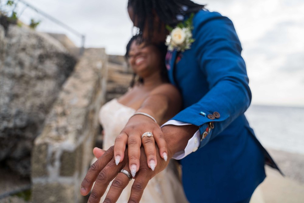 brittany-how-to-plan-a-destination-wedding-in-willemstad-curacao-dreams-curacao-resort-review-black-destination-bride-desti-tv-desti-guide-to-destination-weddings-ring-hand-photo-2022-1.jpg
