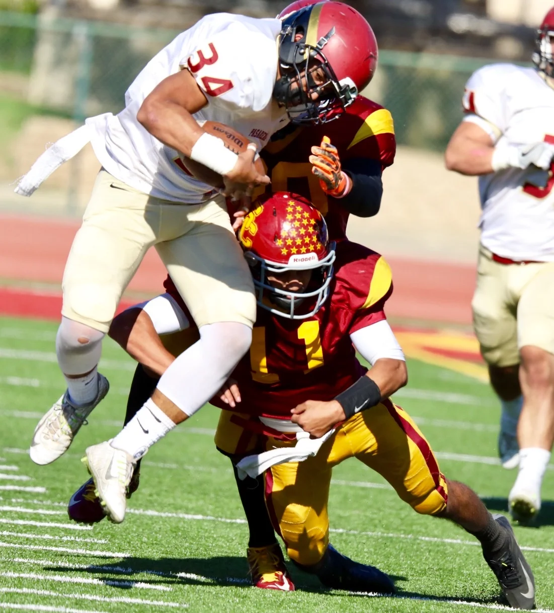 Ty Apana-Purcell (34) of Pasadena City College gets tackled by Alonzo Griffen (11) of Glendale Community College after he attempts to take a blocked extra point down field against Glendale in the lancers 25-3 loss on the road on Oct. 22, 2016.