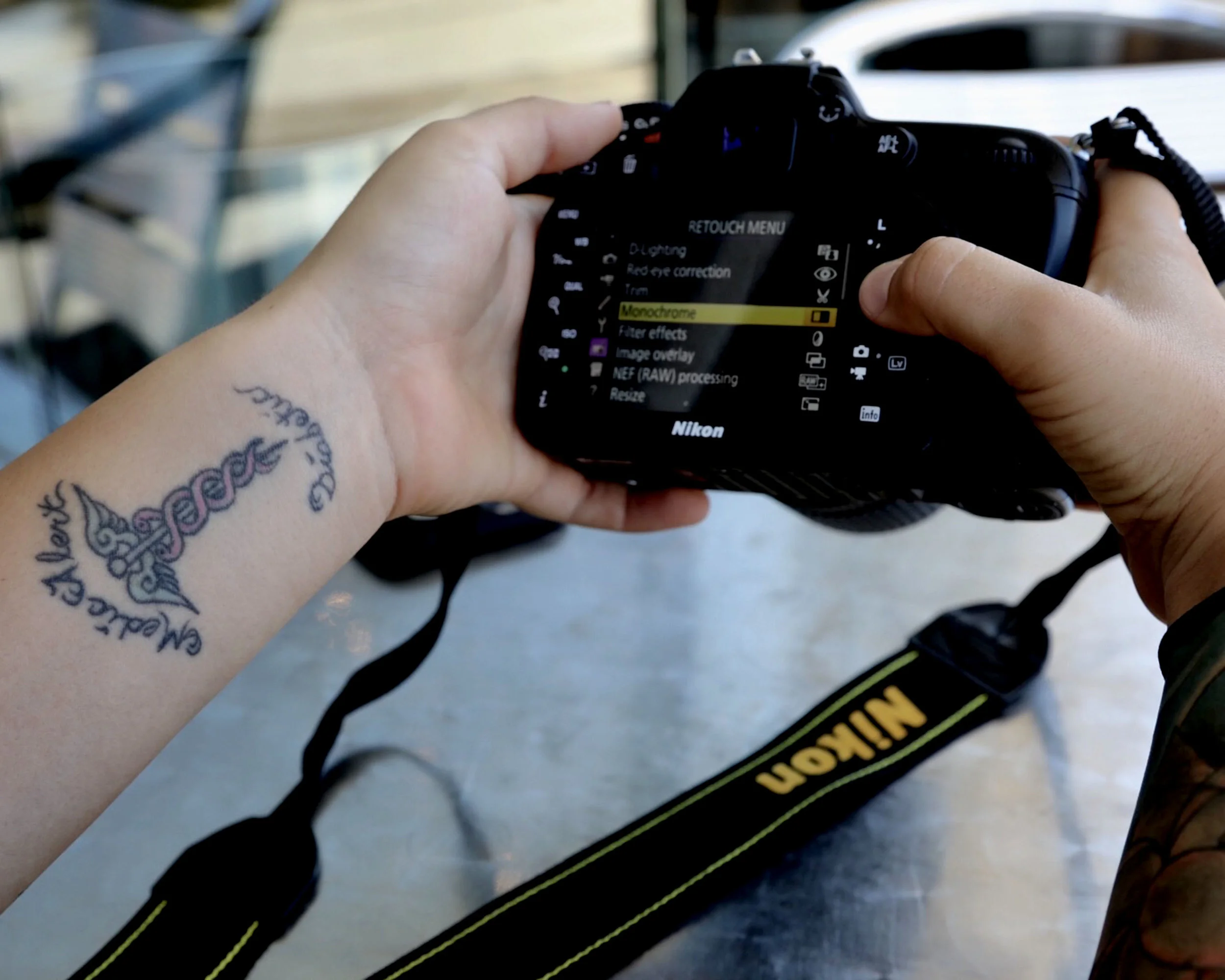 Laura Pavlakovich, founder of the nonprofit “You’re Just My Type” reviews her camera settings before a shoot in Los Angeles on Nov. 3, 2016.