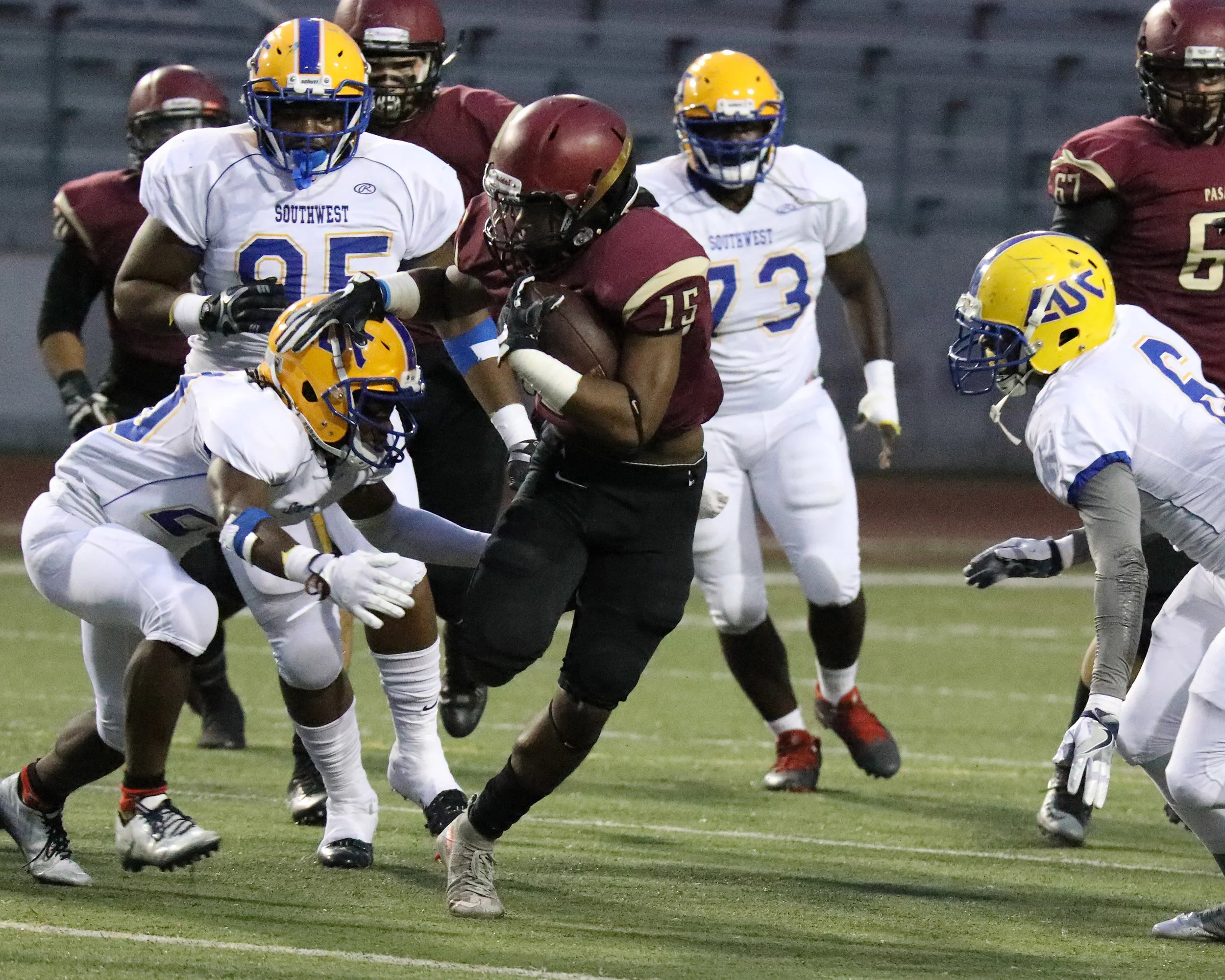 James Shaw of Pasadena City College splits the defenders on a scoring drive during the Lancers 42-14 win over L.A. Southwest on Saturday Oct. 29, 2016.