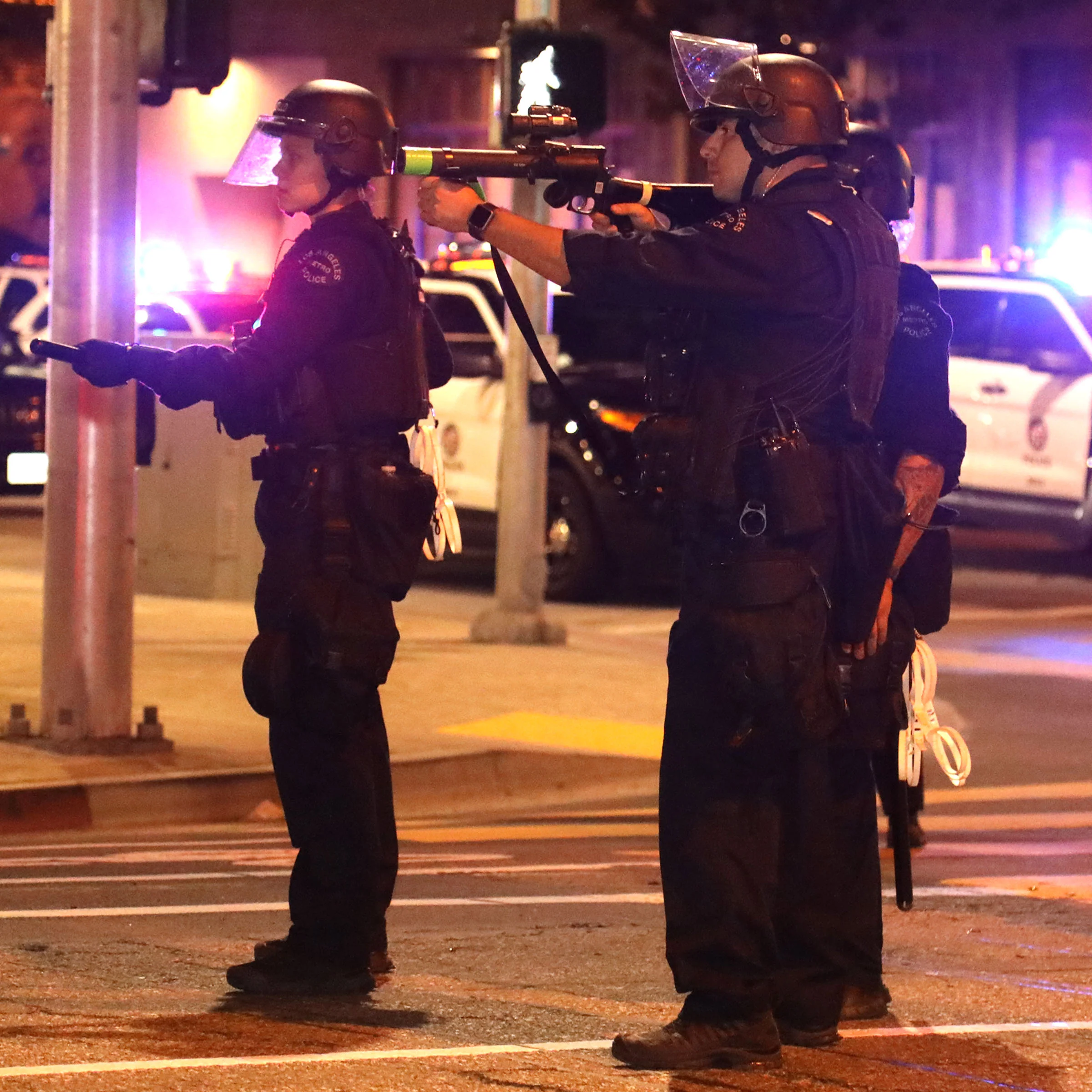 Officers prepare to take an offensive stance as protesters fail to disperse at the protest held in response to the outcome of the presidential election in Downtown Los Angeles on Nov. 10, 2016