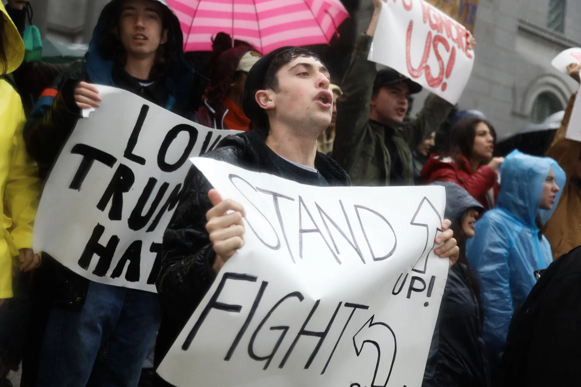 Protestors hold up their signs in unity during the United Against Hate march on Friday Jan. 20, 2017