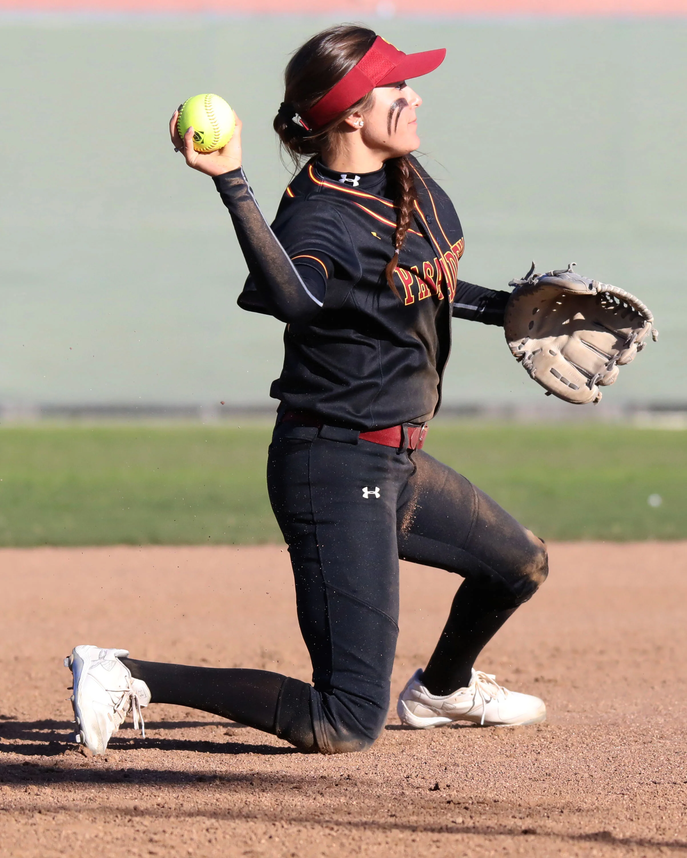 Michael Watkins/ Courier Karina Moreno of Pasadena City College throws to first from her knees after a diving stop during PCCs 14-0 win against El Camino College Compton Center on Thursday Feb. 24, 
