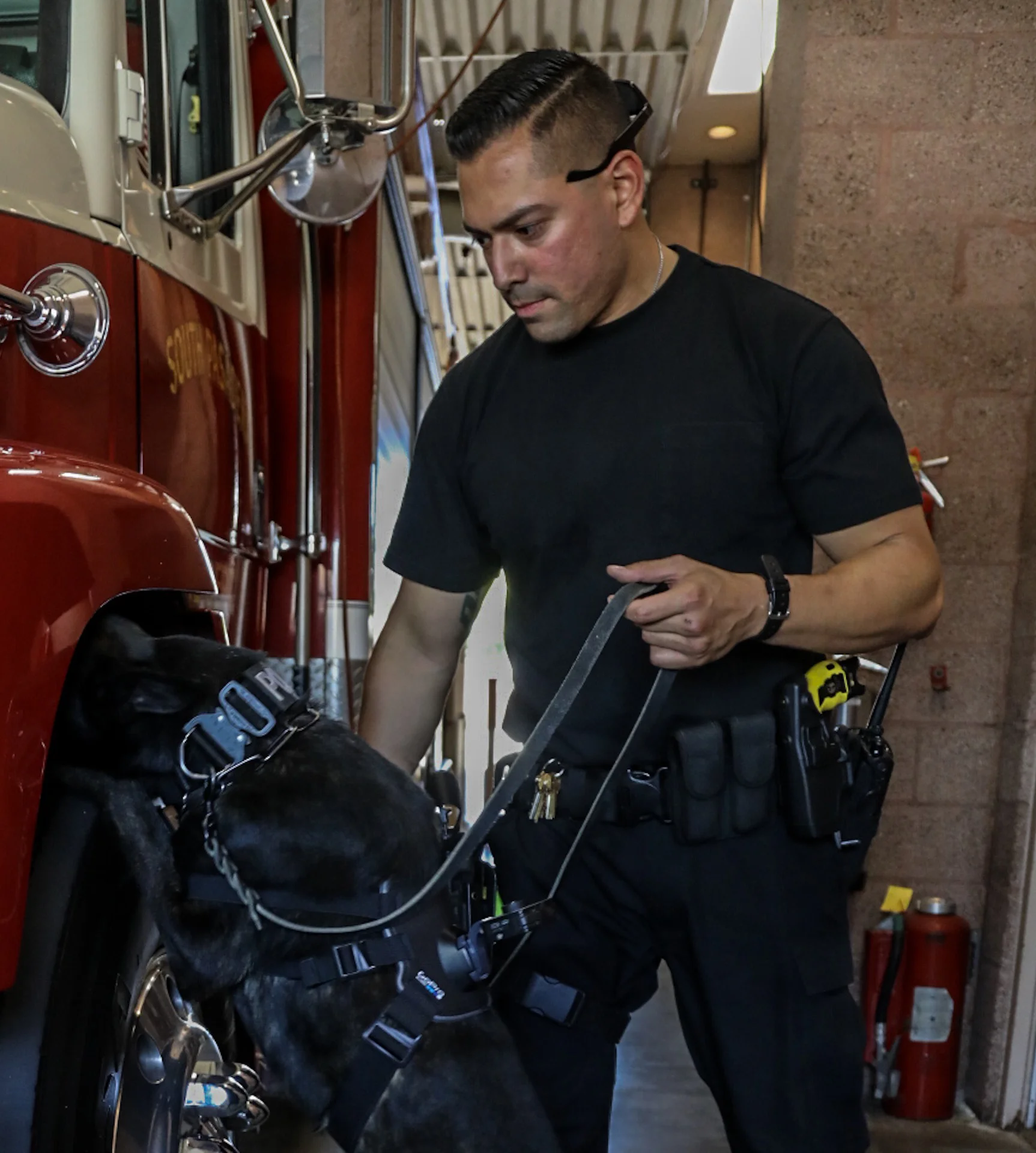 Michael Watkins/ Courier Officer Chris Perez of the South Pasadena Police Department has Barry the K-9 search the fire truck where he has hidden a cocaine scent on April 20, 2017.