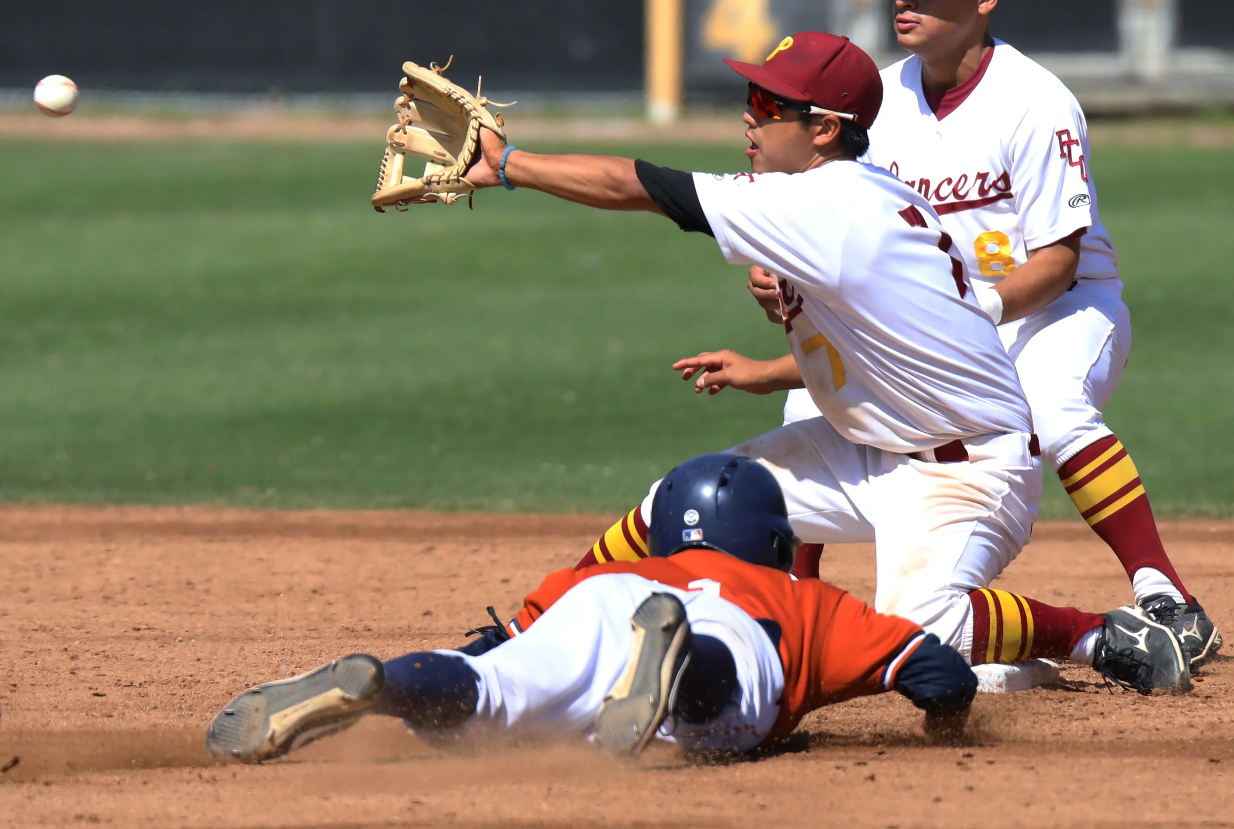 Michael Watkins/ Courier Andres Kim of PCC takes a throw down to second in an attempt at catching Kyosuke Ushimaru from Citrus College stealing during the Lancers 11-9 Loss at home on April 7, 2017.