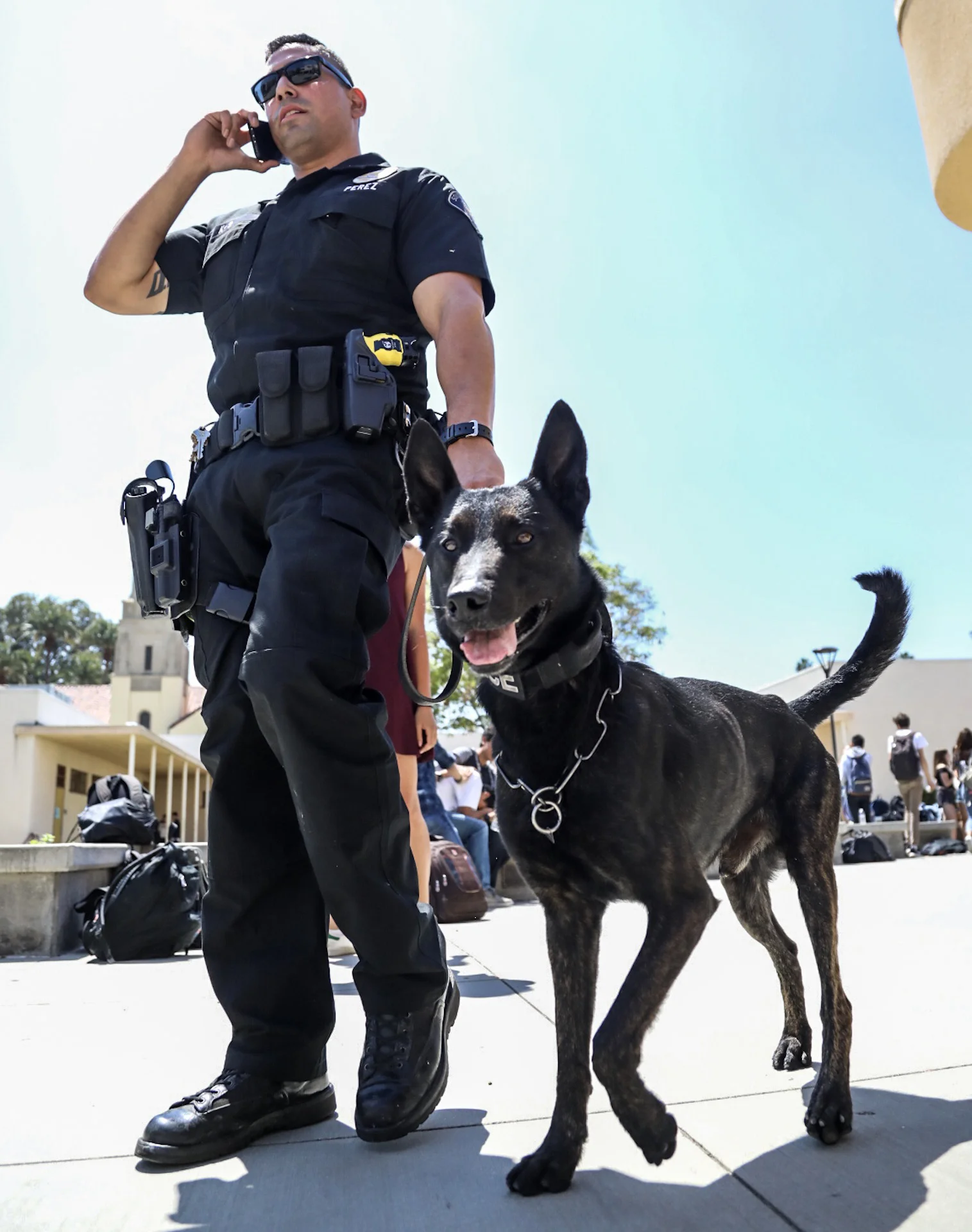Michael Watkins/ Courier Officer Chris Perez of the South Pasadena Police Department walks with his Partner Barry the K-9 unit through South Pasadena High School on April 20, 2017.