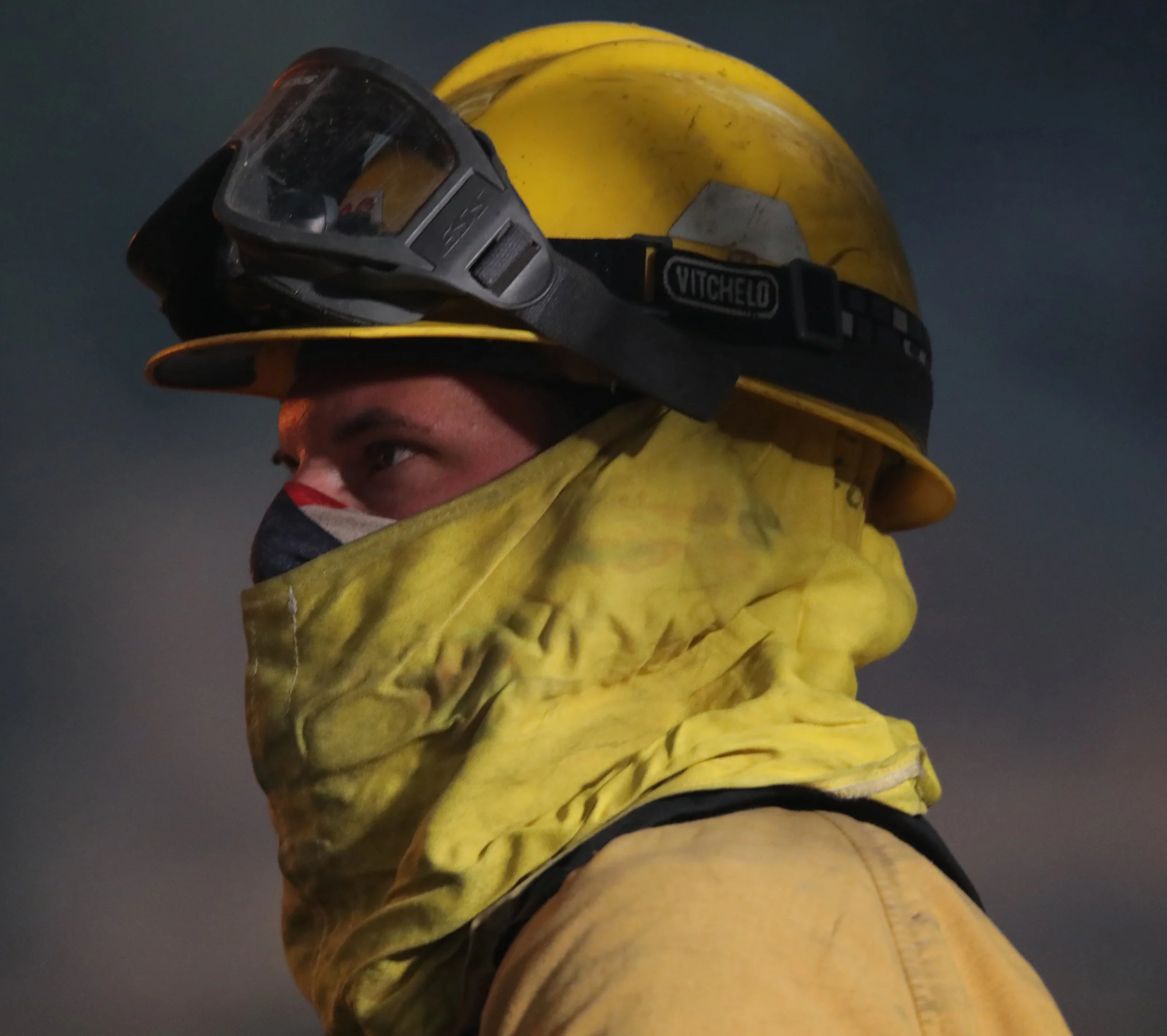 Michael Watkins A firefighter from Sonoma County sprays down a spot fire in the back yard of a property in Fillmore Calif. in the early morning hours on December 15, 2017 while battling the Thomas Fire.