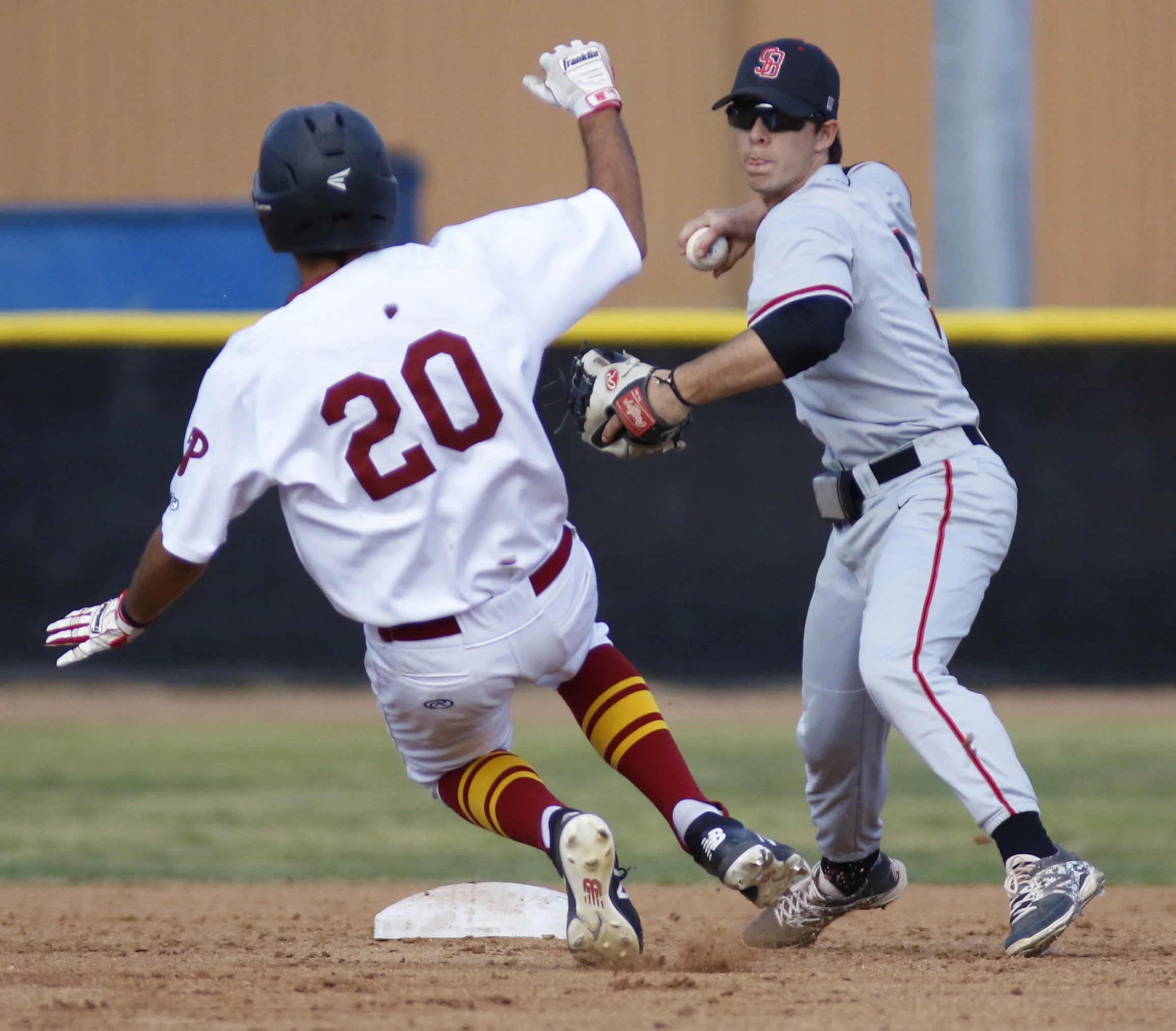 Michael Watkins/ Courier John Bicos (20) of PCC slides to break up a double play by Shane Hersh of SBCC during PCC’s 6-3 home win over Santa Barbara City College on Wednesday, February 28, 2018. 