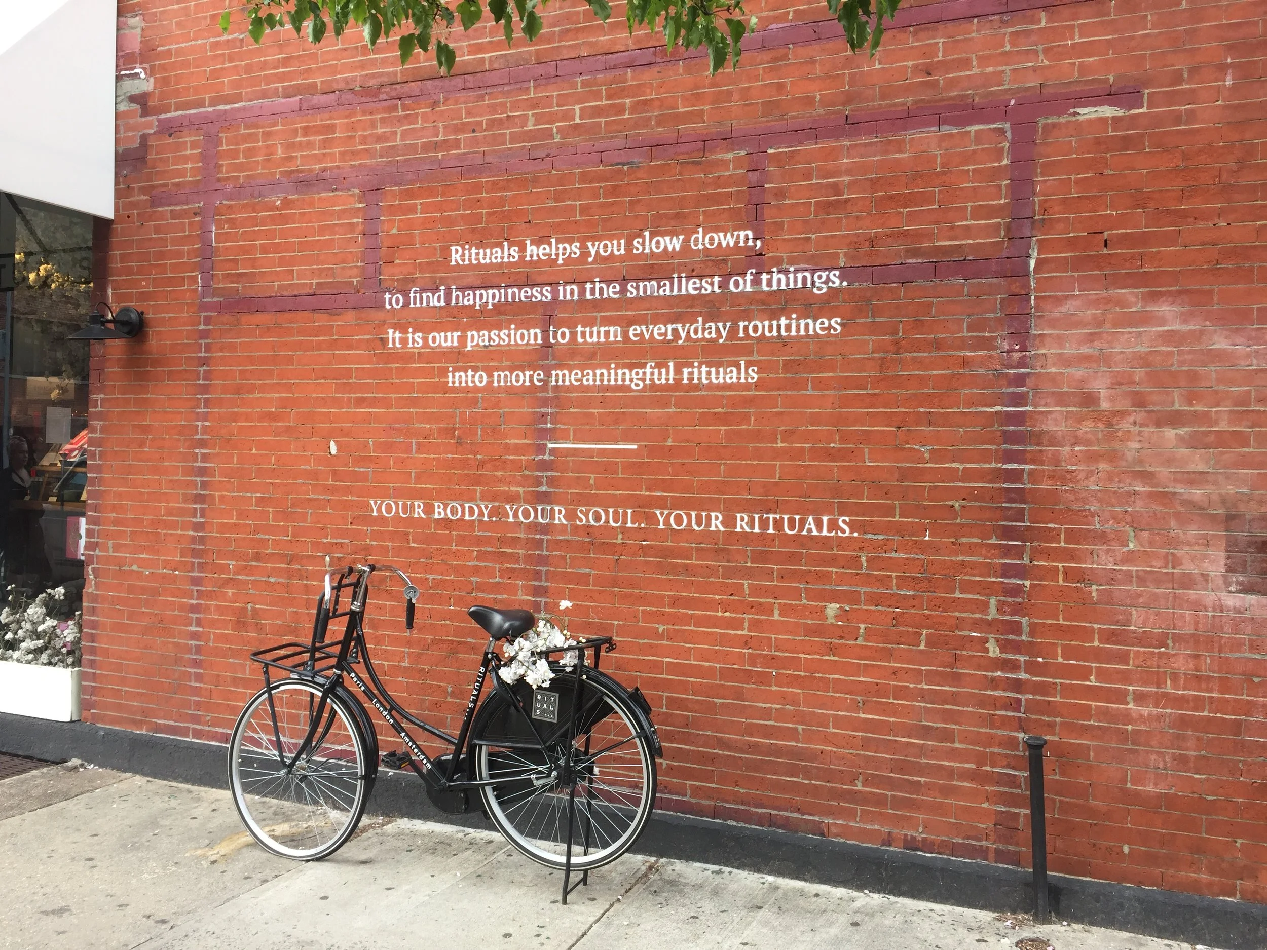 Rituals - a Japanese cosmetics chain - suggests that its range of perfumes, soaps, and incenses will help us to discover deeper meaning in our everyday routines. Edgy street art outside their East Williamsburg store lends this claim an air of prophe…