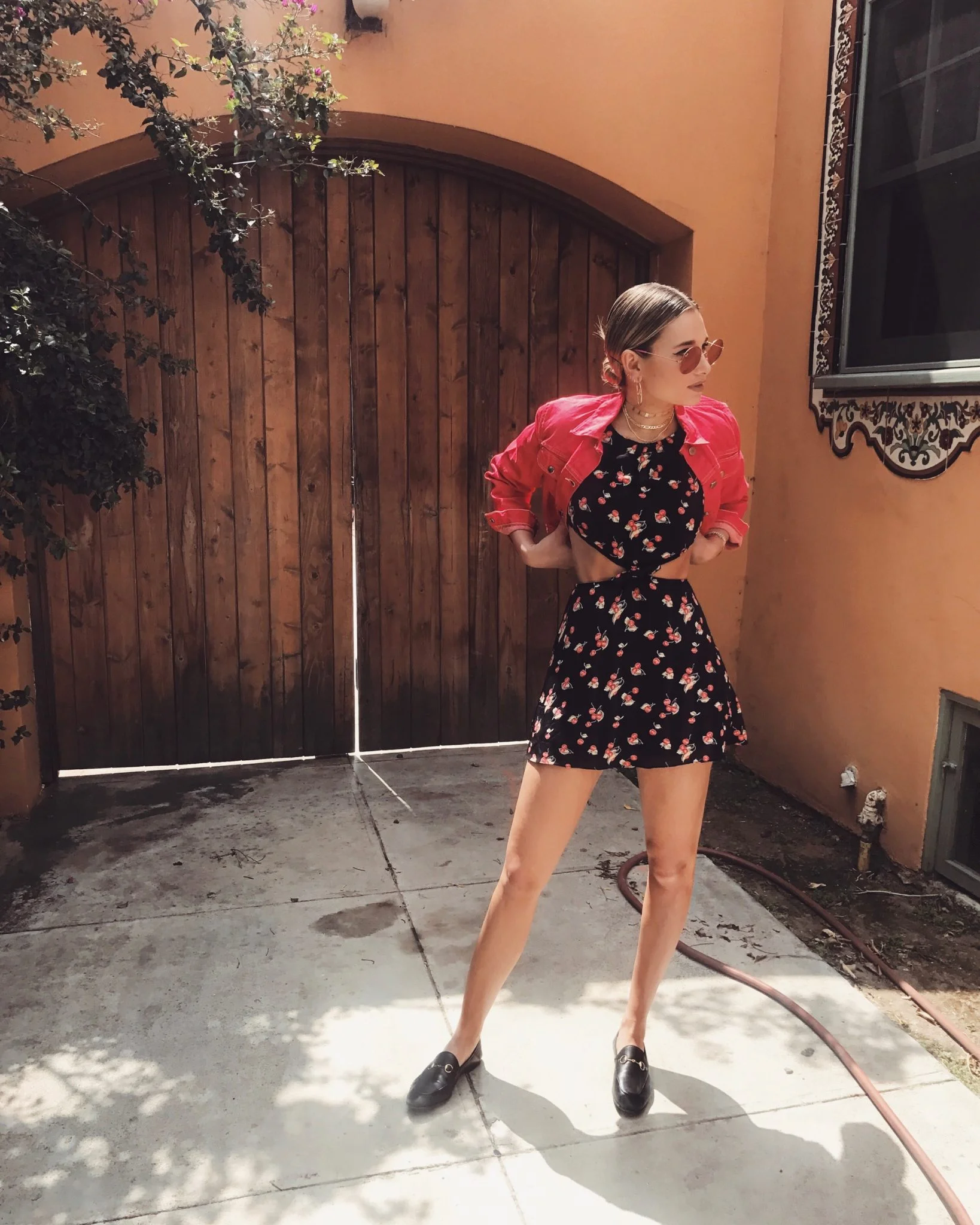 Danielle Bernstein of @weworewhat in For Love & Lemons Cherry Waist Cut Out Dress - Black