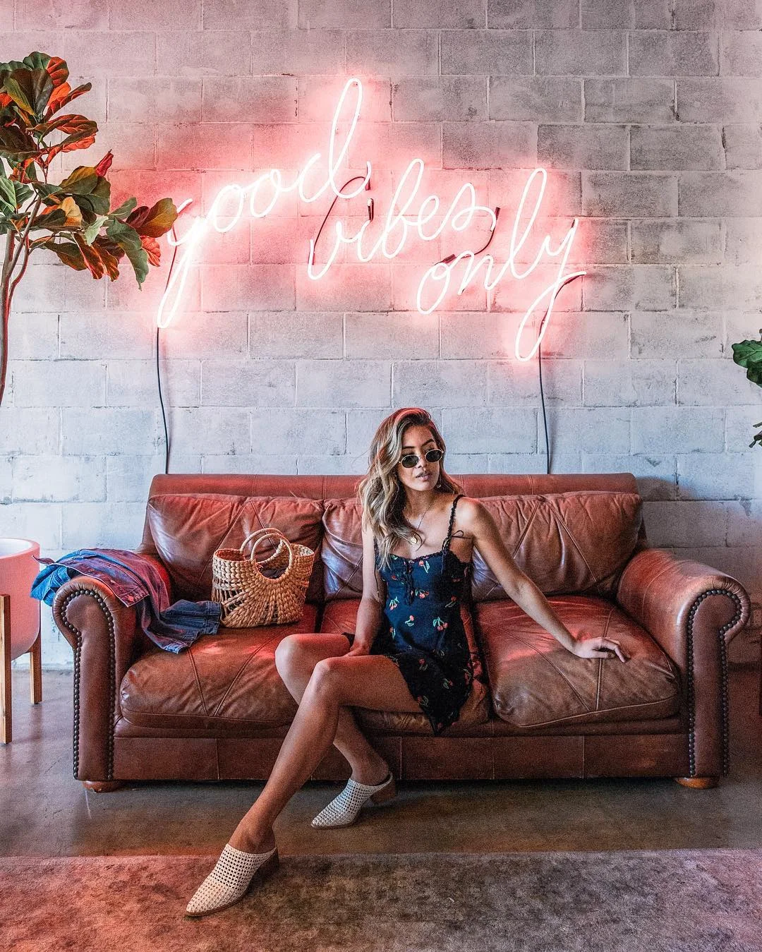 Jill Wallace of @littleblackboots in For Love & Lemons Cherry Twist Tank Mini Dress
