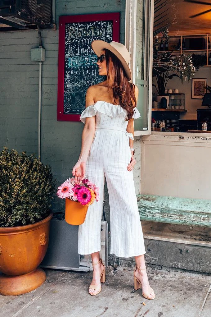 Kristi Hemric of @khemric in ASTR the Label Keely Off The Shoulder Striped Jumpsuit