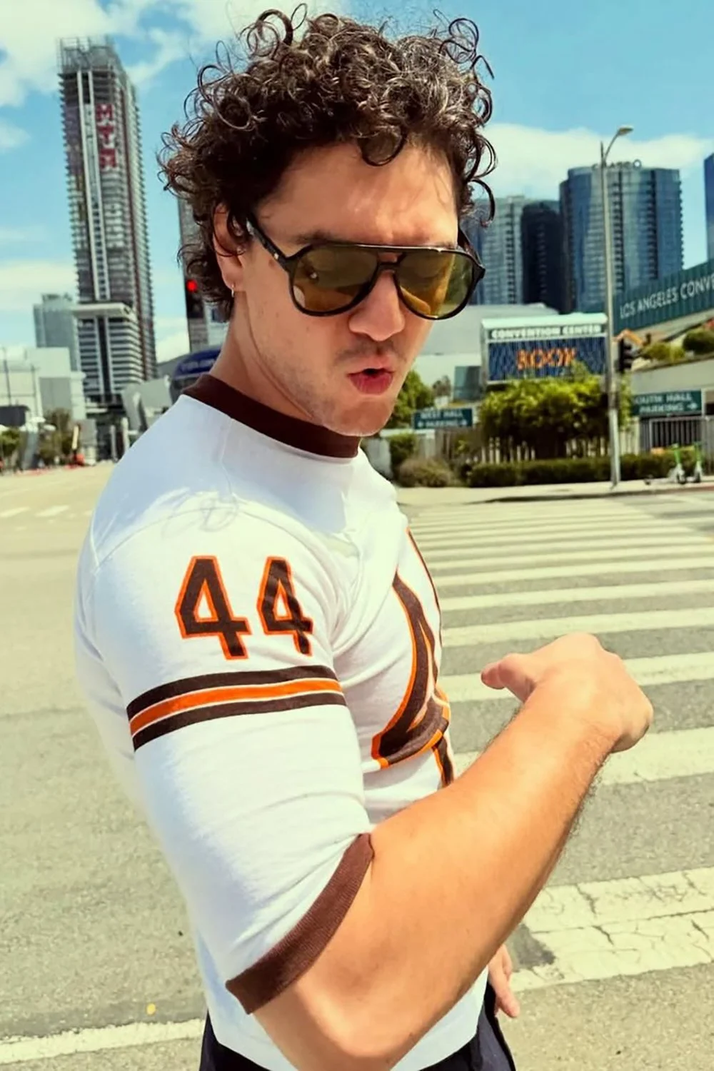 Belmont Cameli in Le Specs Tragic Magic Sunglasses - Black - Tan Tint