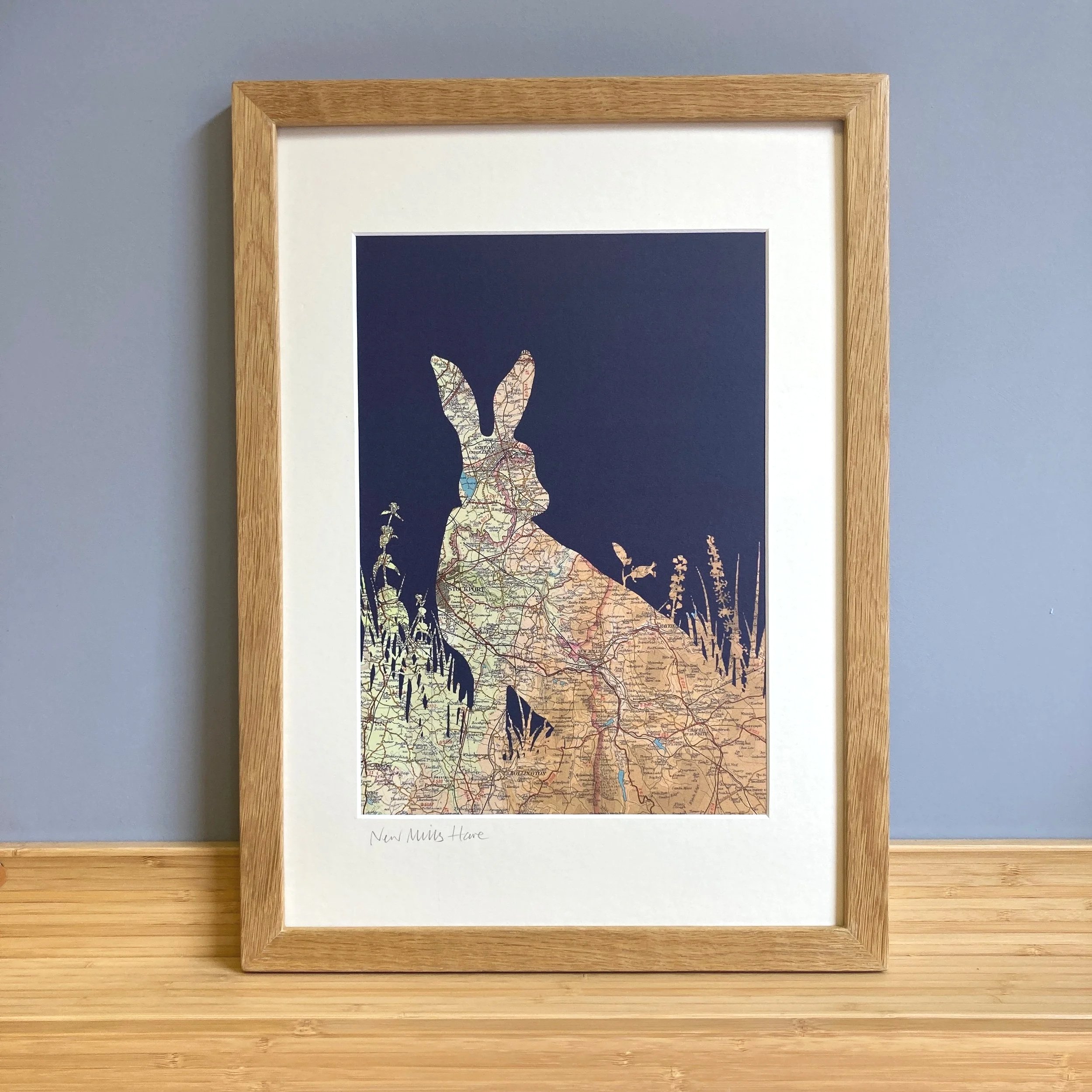 A vintage map print of a wild Hare with navy background, featuring a map of the High Peak in Derbyshire