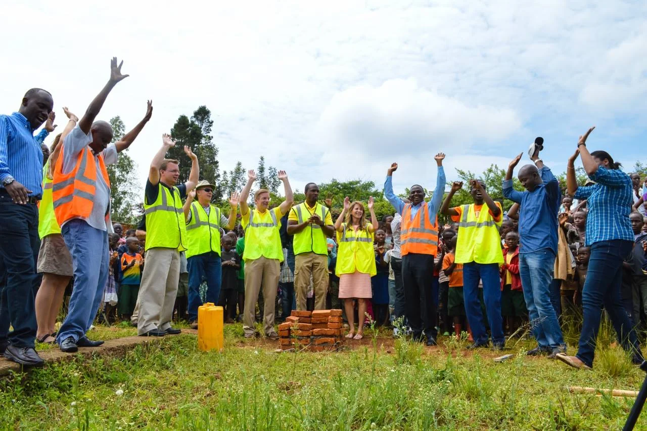 The first bricks are laid in place