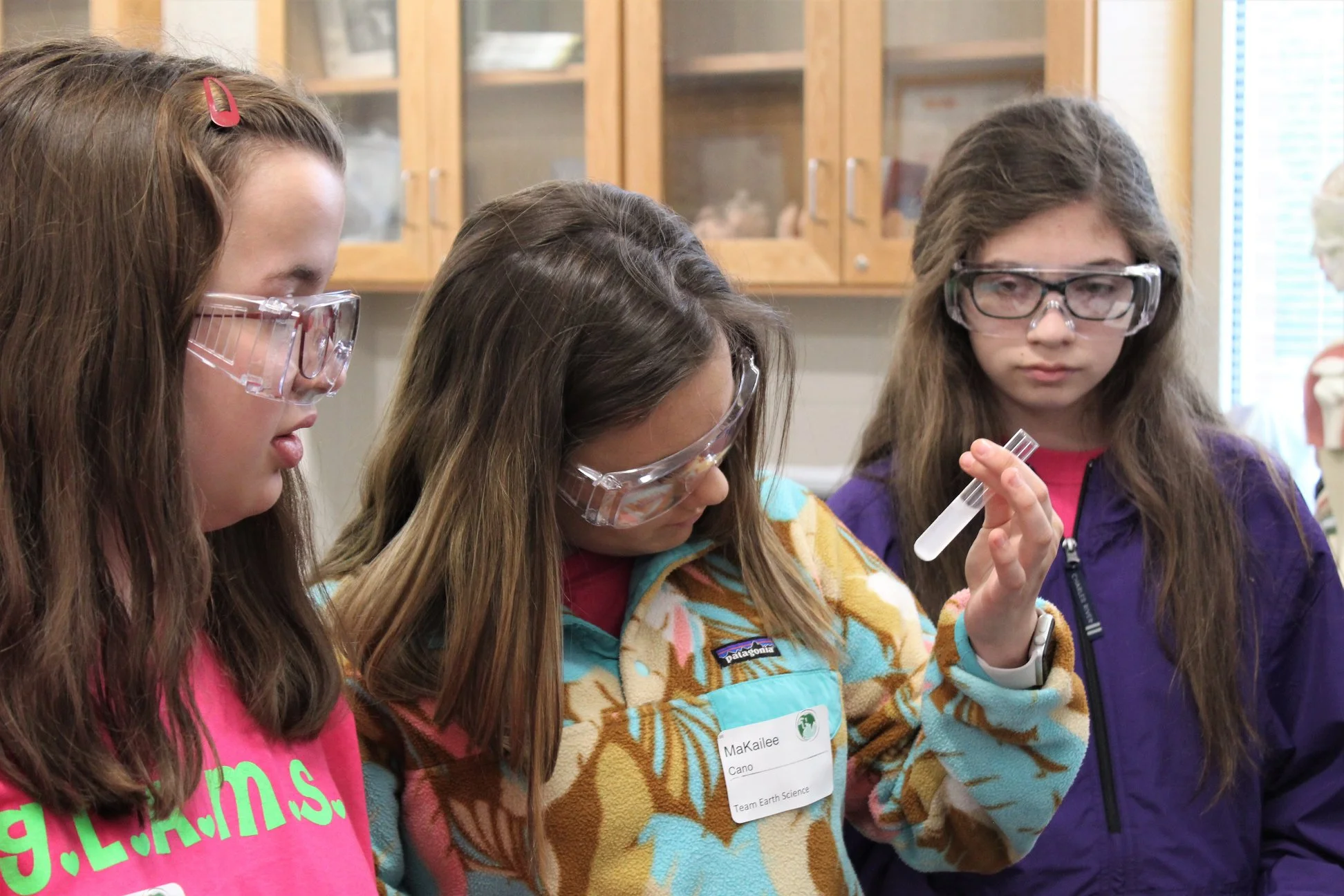 South Arkansas Community College Girls Learning about Math and Science (GLAMS) participating in a chemistry experiment.